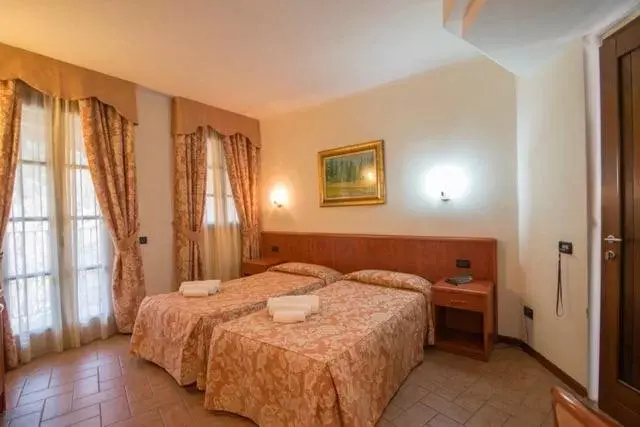 Bed in Albergo Giardino