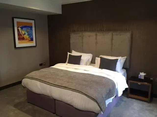 Bed in Ten Square Hotel