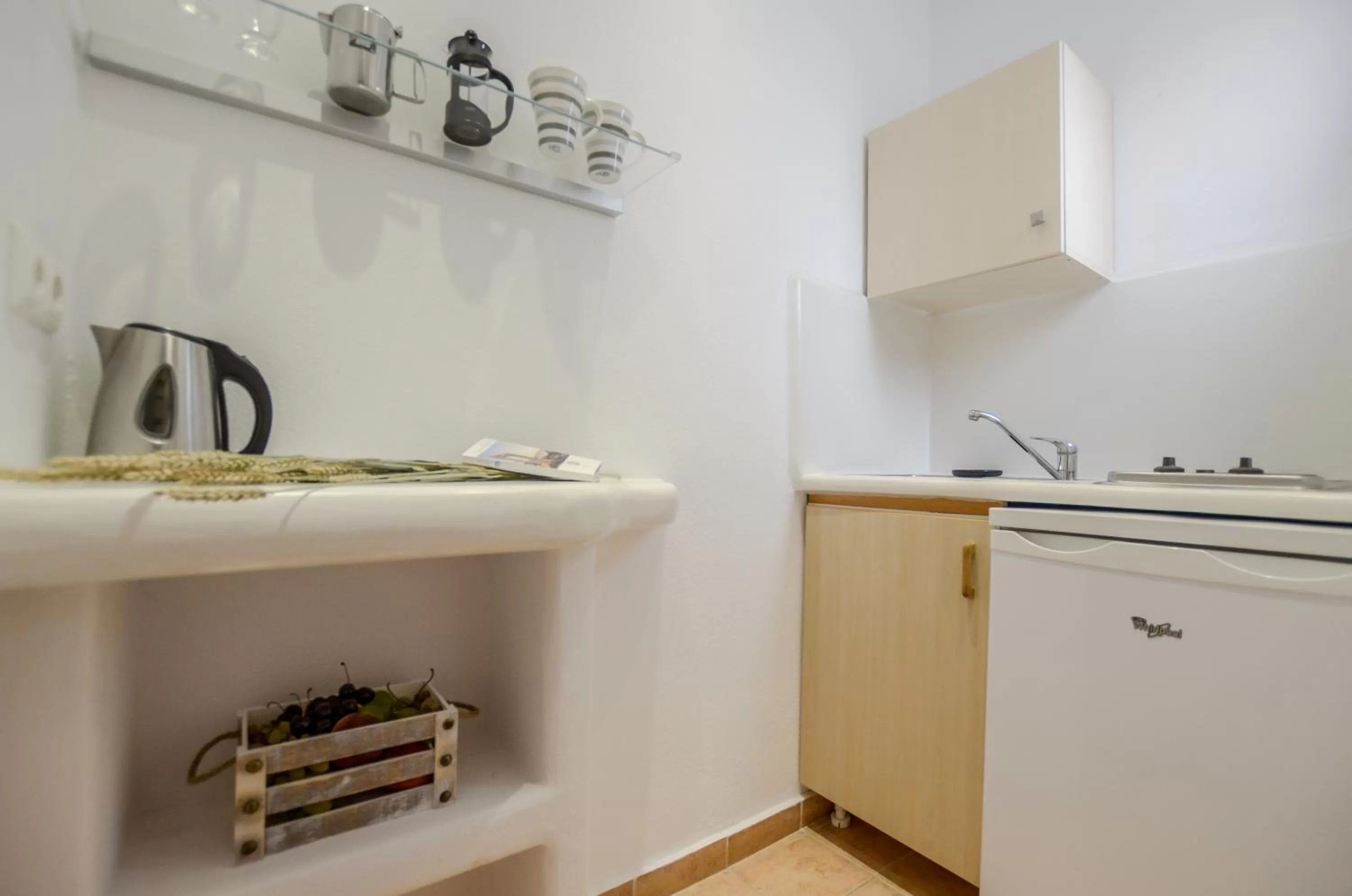 Kitchen or kitchenette in Panormos Hotel and Studios