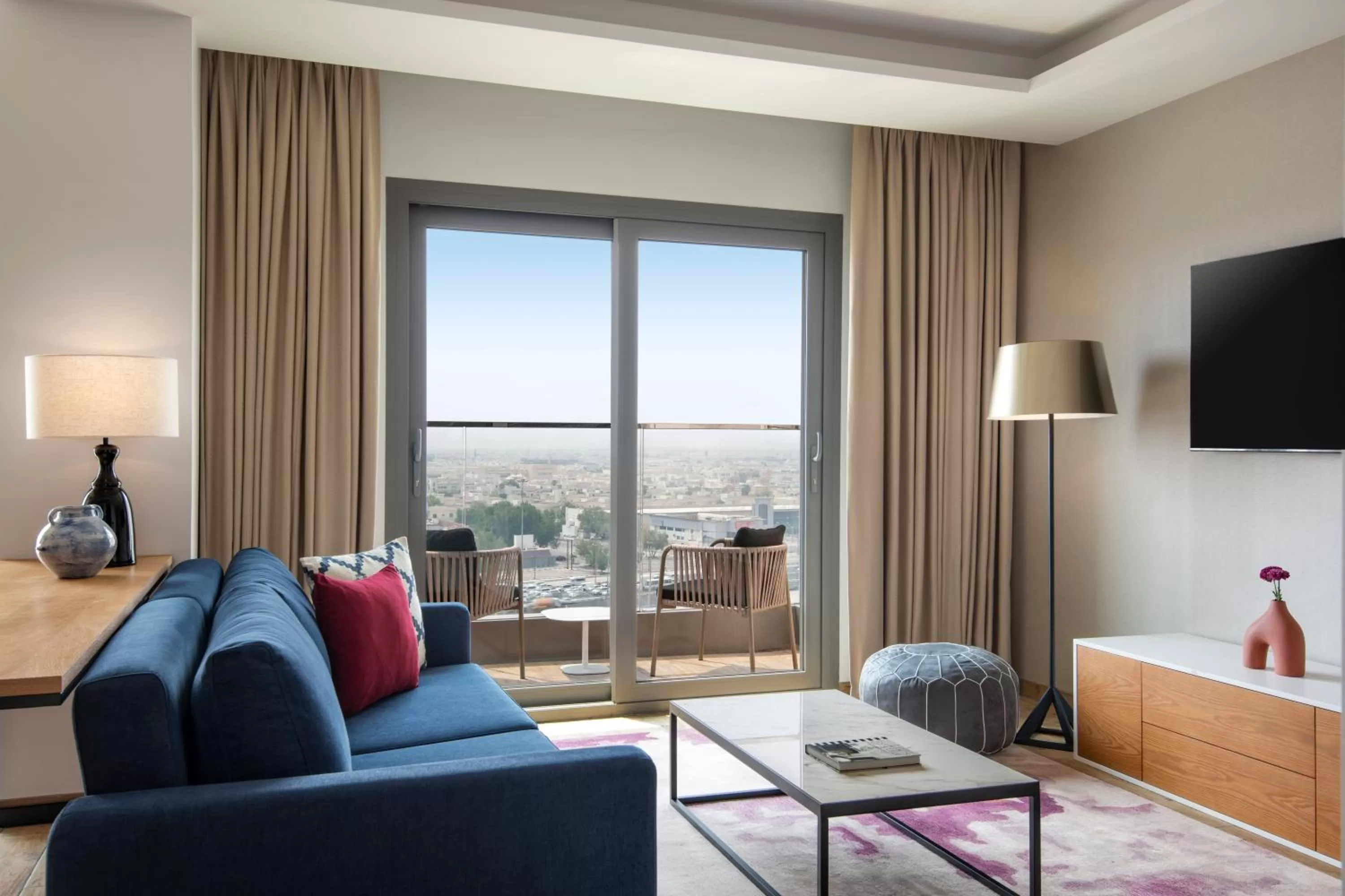 Living room in Abesq Doha Hotel and Residences, an IHG Hotel