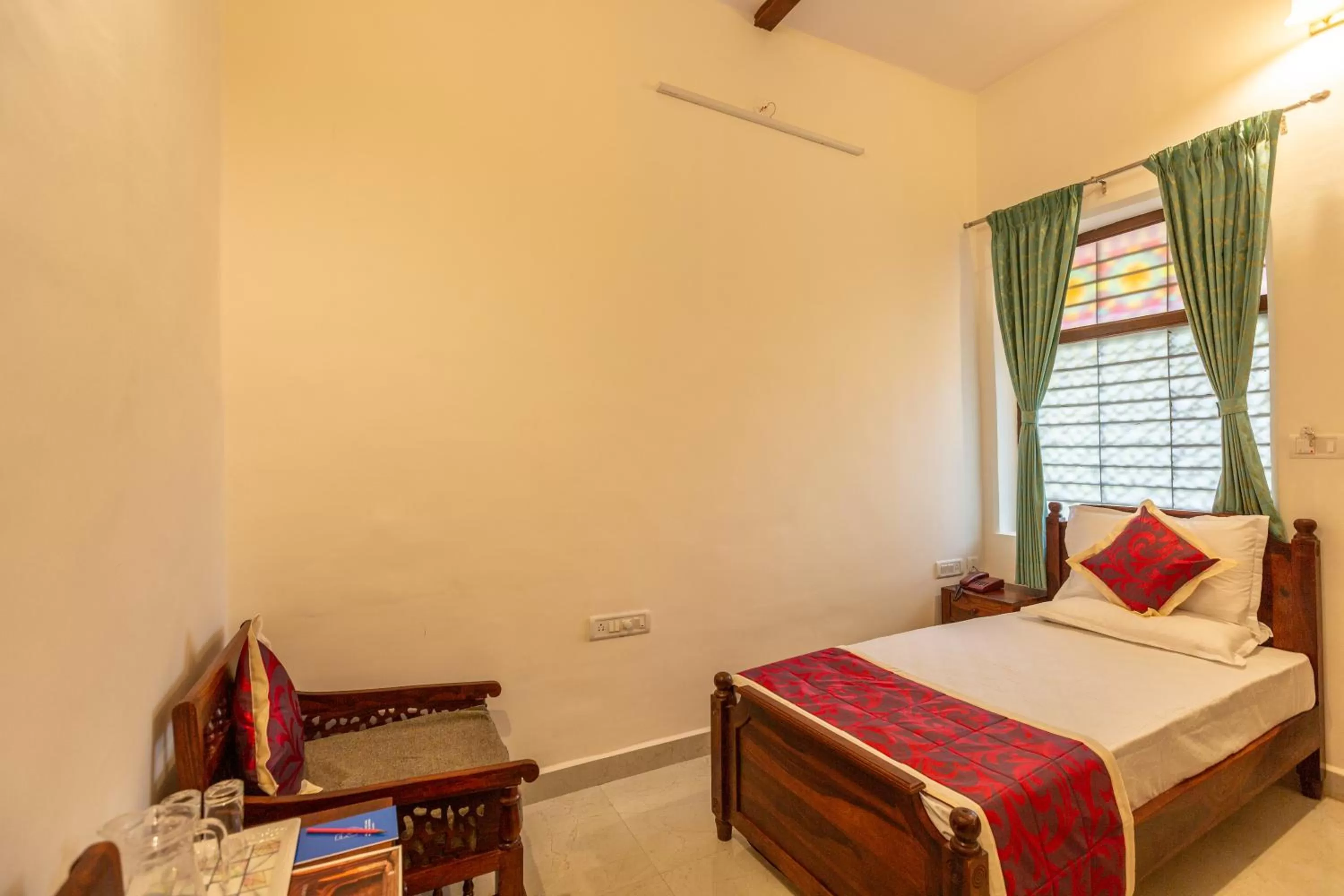 Bed in KSTDC Hotel Mayura Adilshahi Bijapur