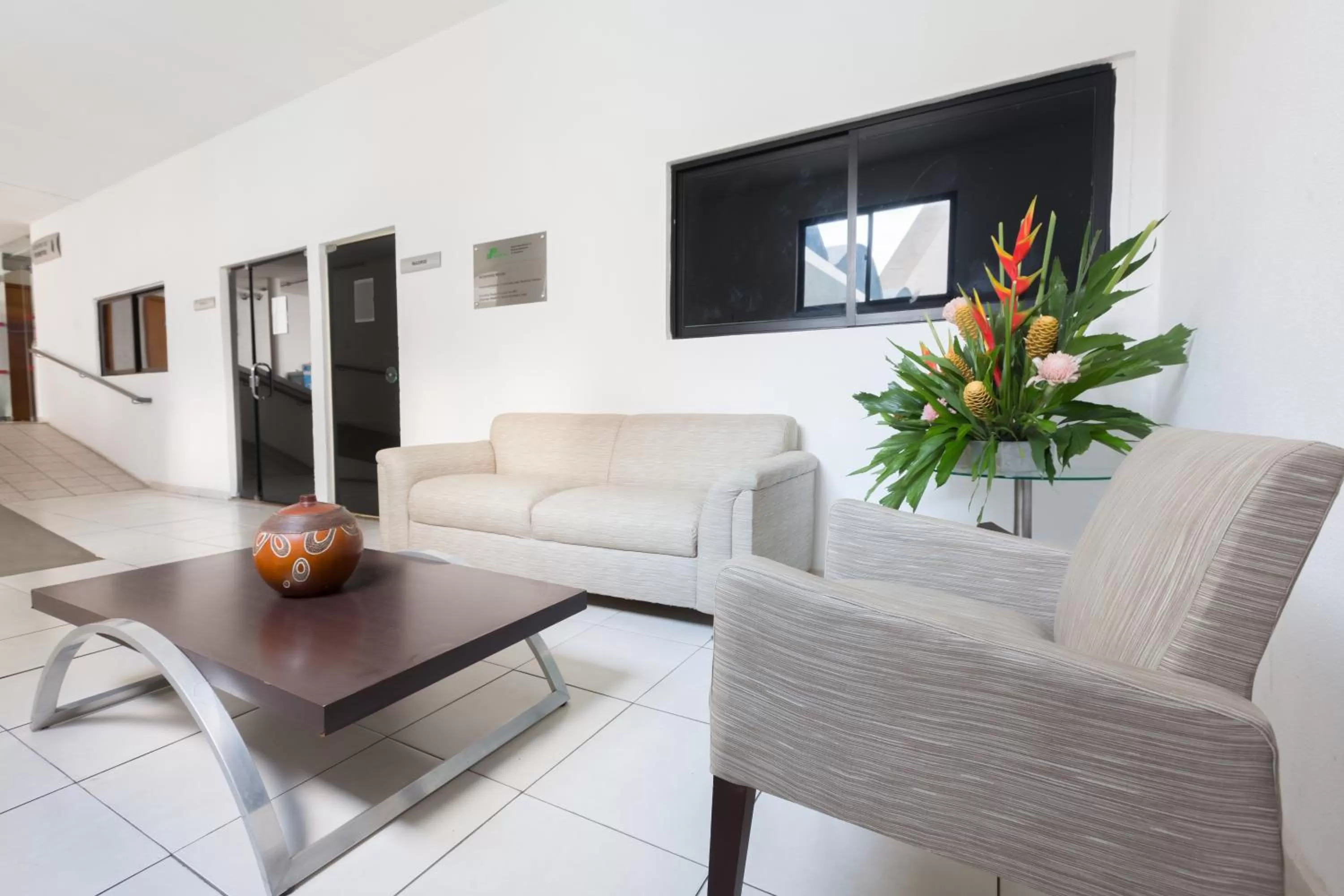 Communal lounge/ TV room in Arrey Executive Hotel