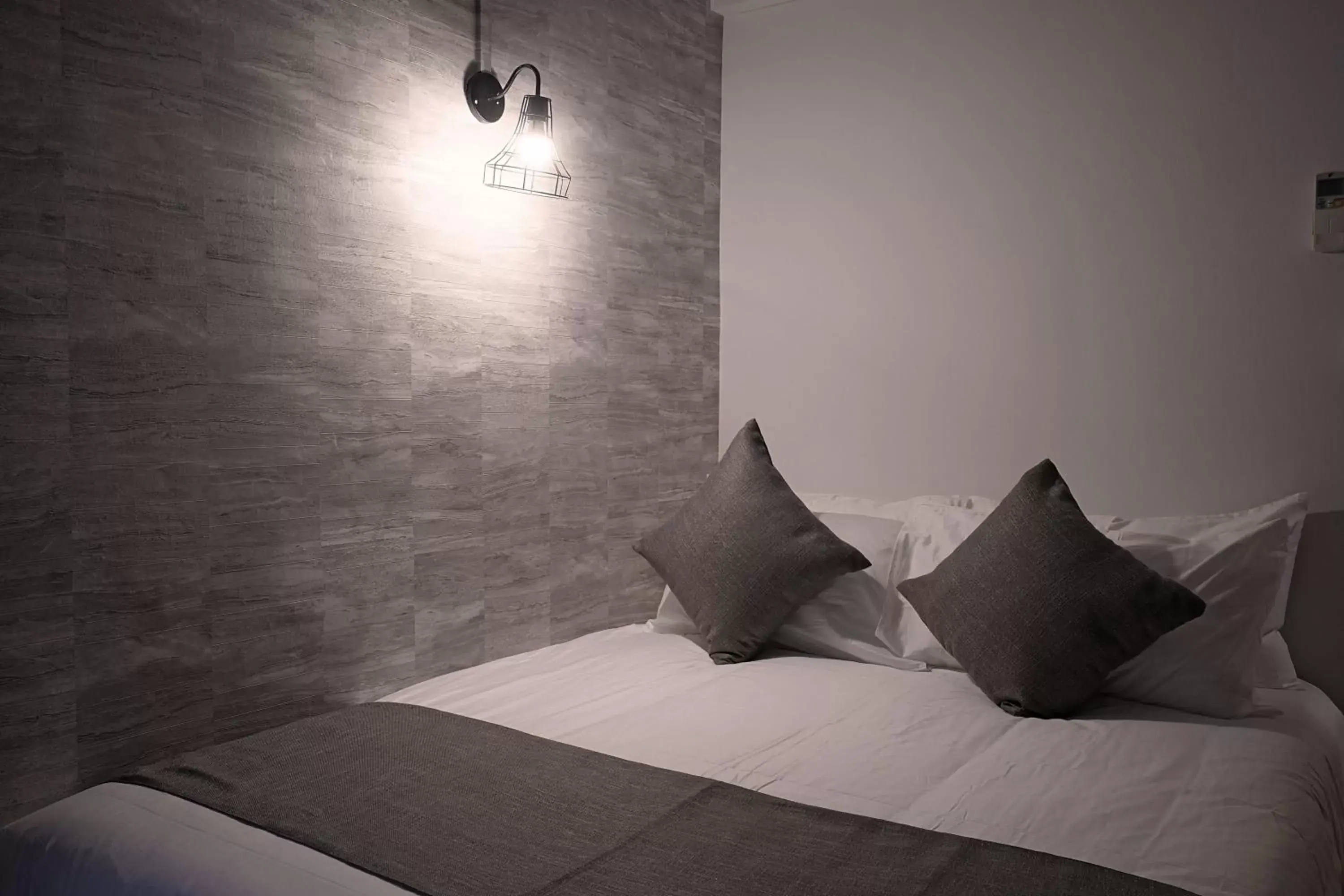 Bed in Q Loft Hotels at Bedok