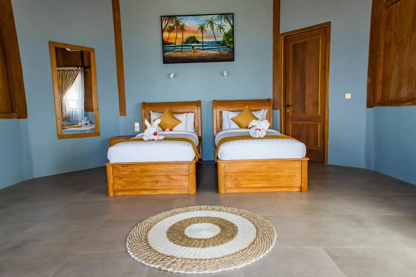 Bed in Blue Harbor Beachfront Villas & Resto