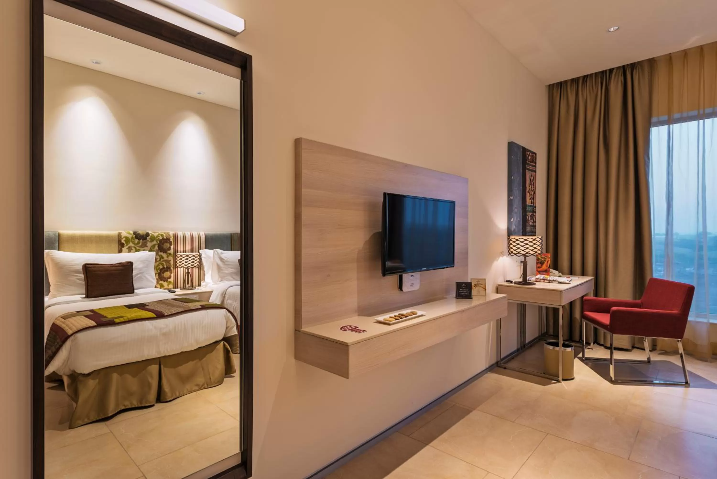 Bedroom, TV/Entertainment Center in Jakson Inns