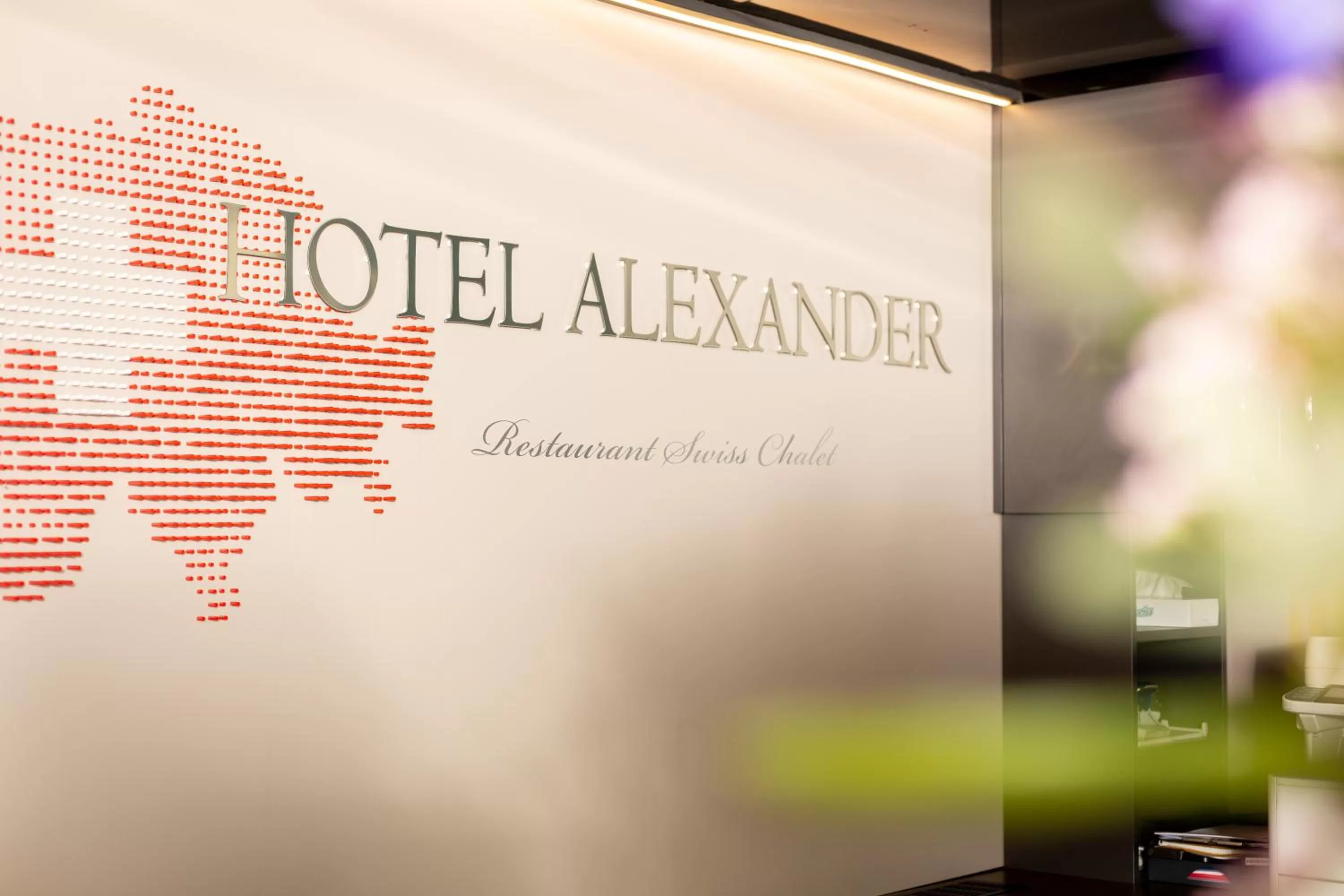 Property logo or sign in Hotel Alexander