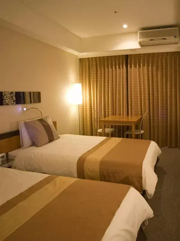 Photo of the whole room, Bed in The Beach Tower Okinawa Hotel