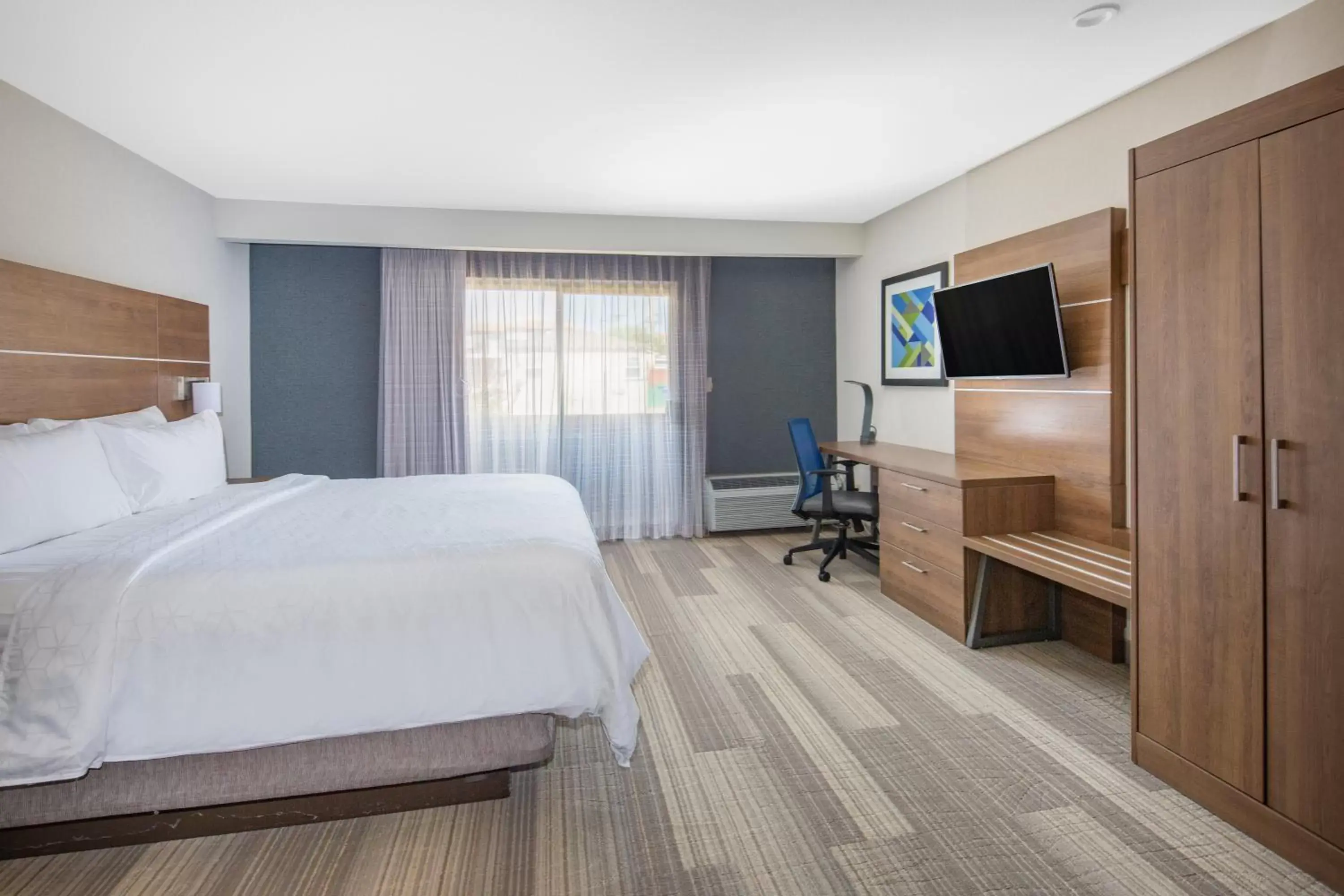 Photo of the whole room, TV/Entertainment Center in Holiday Inn Express Hotel & Suites San Diego Airport - Old Town, an IHG Hotel