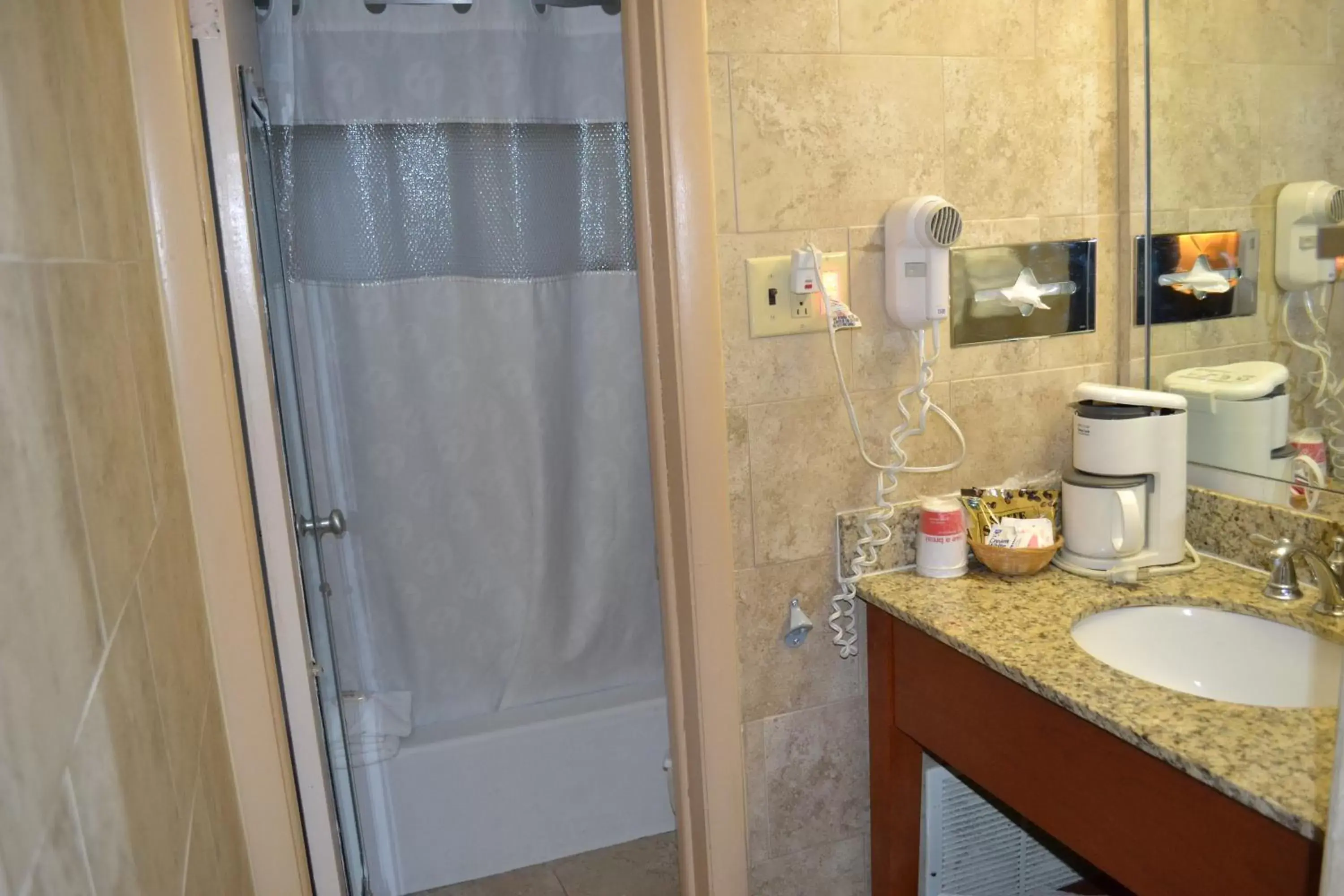 Bathroom in Ramada by Wyndham State College Hotel & Conference Center