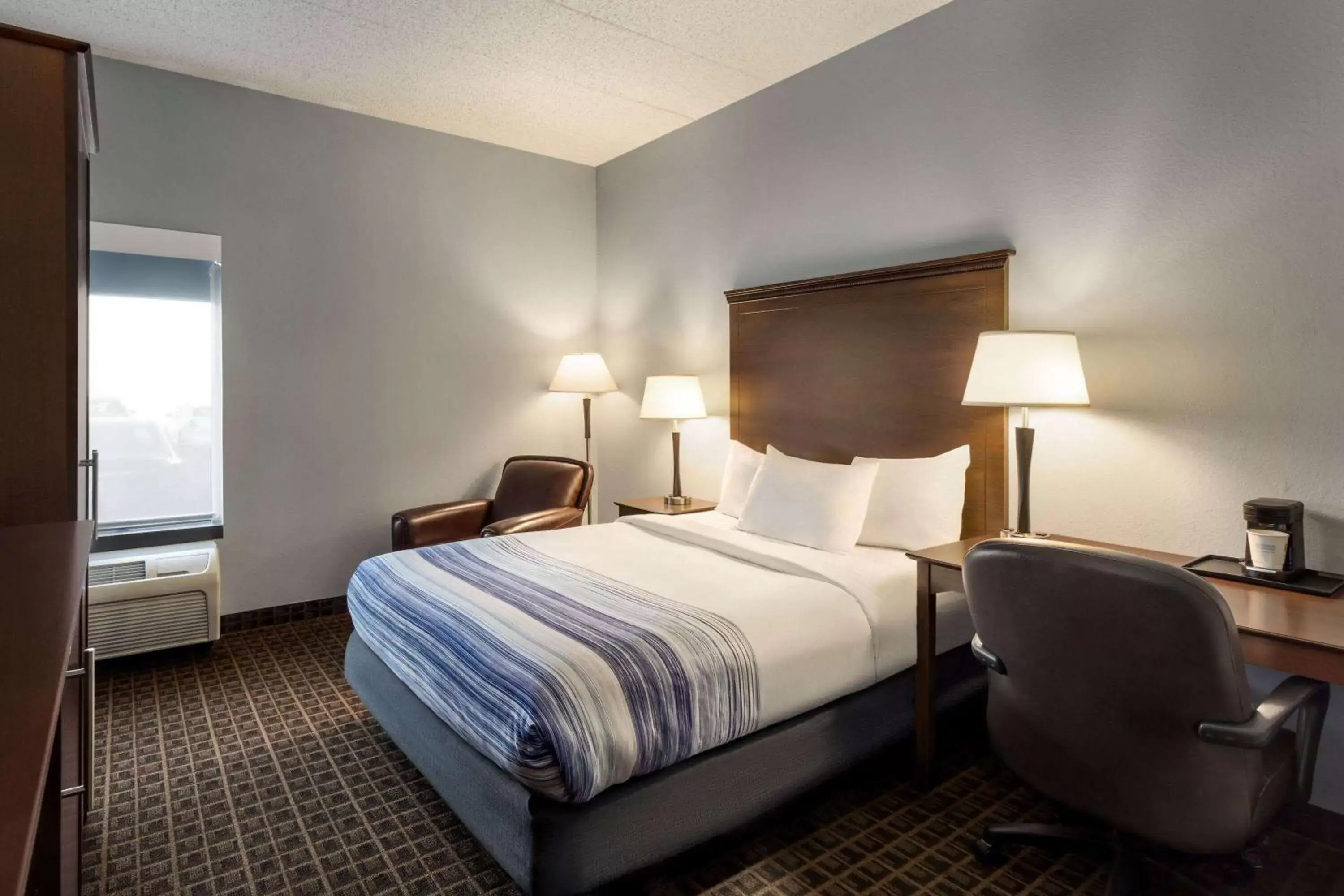 Photo of the whole room, Bed in AmericInn by Wyndham Madison West