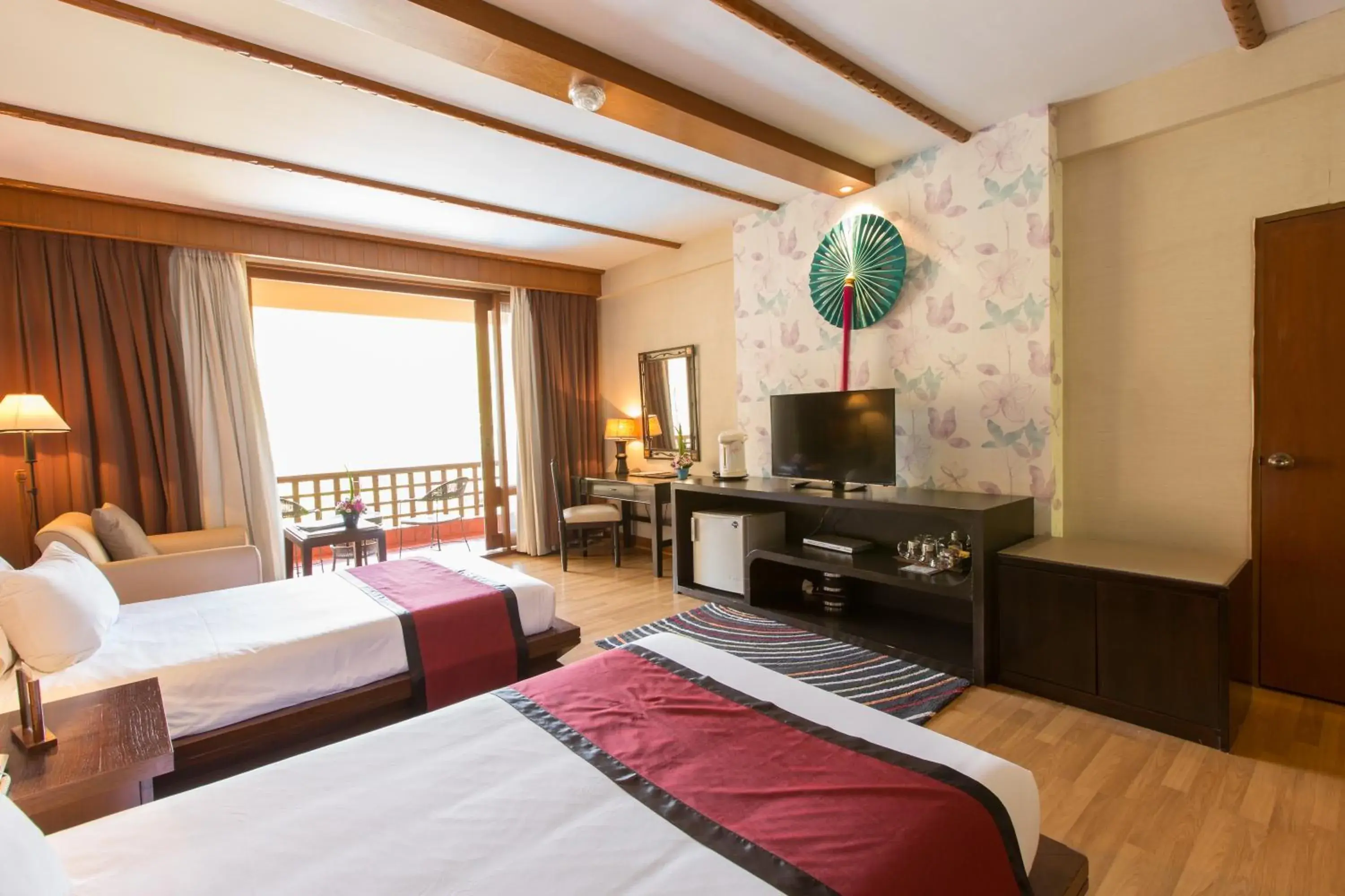 Bed, TV/Entertainment Center in Belle Villa Resort, Chiang Mai