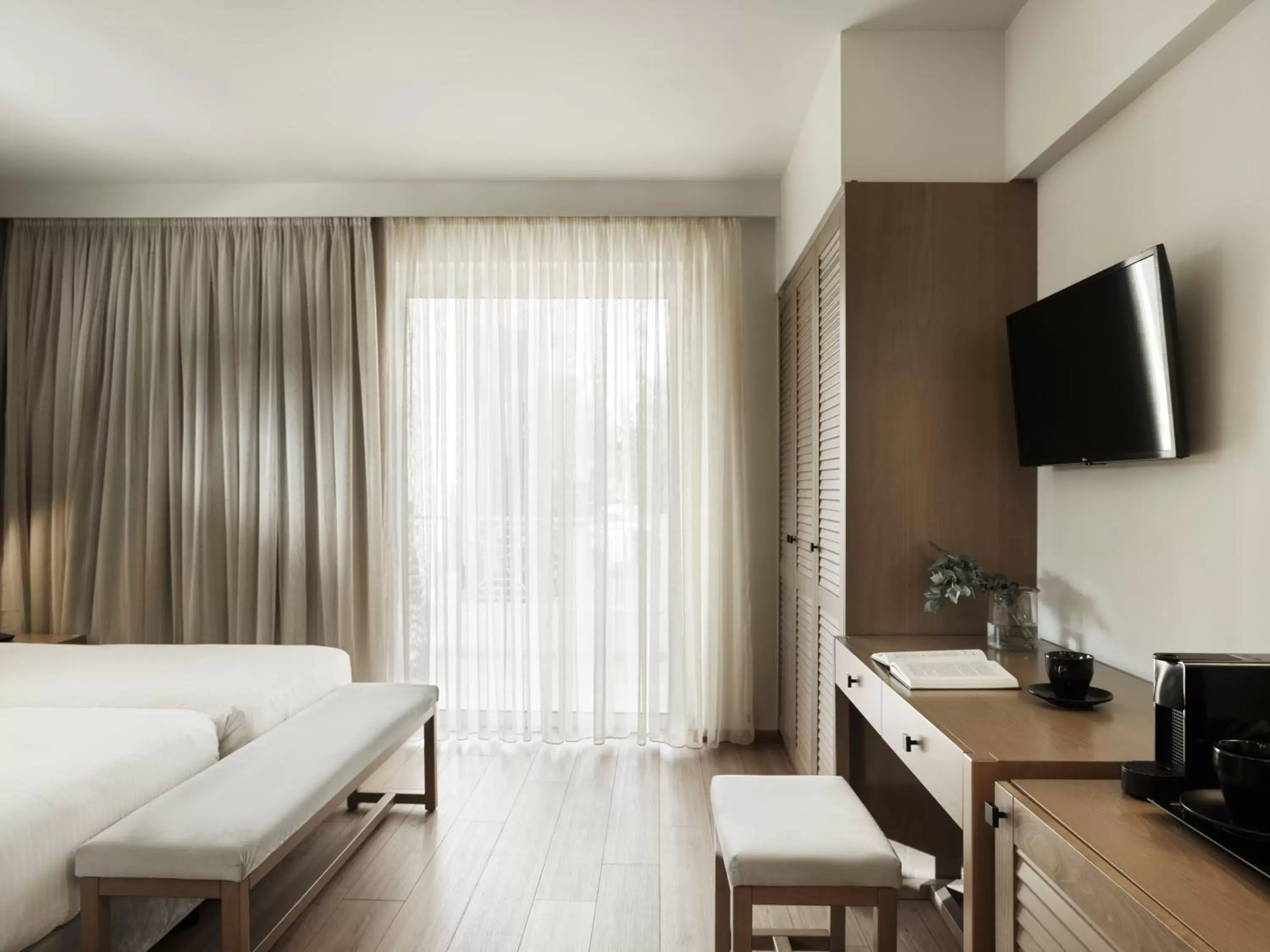 Bed, Seating Area in Civitel Attik Rooms & Suites