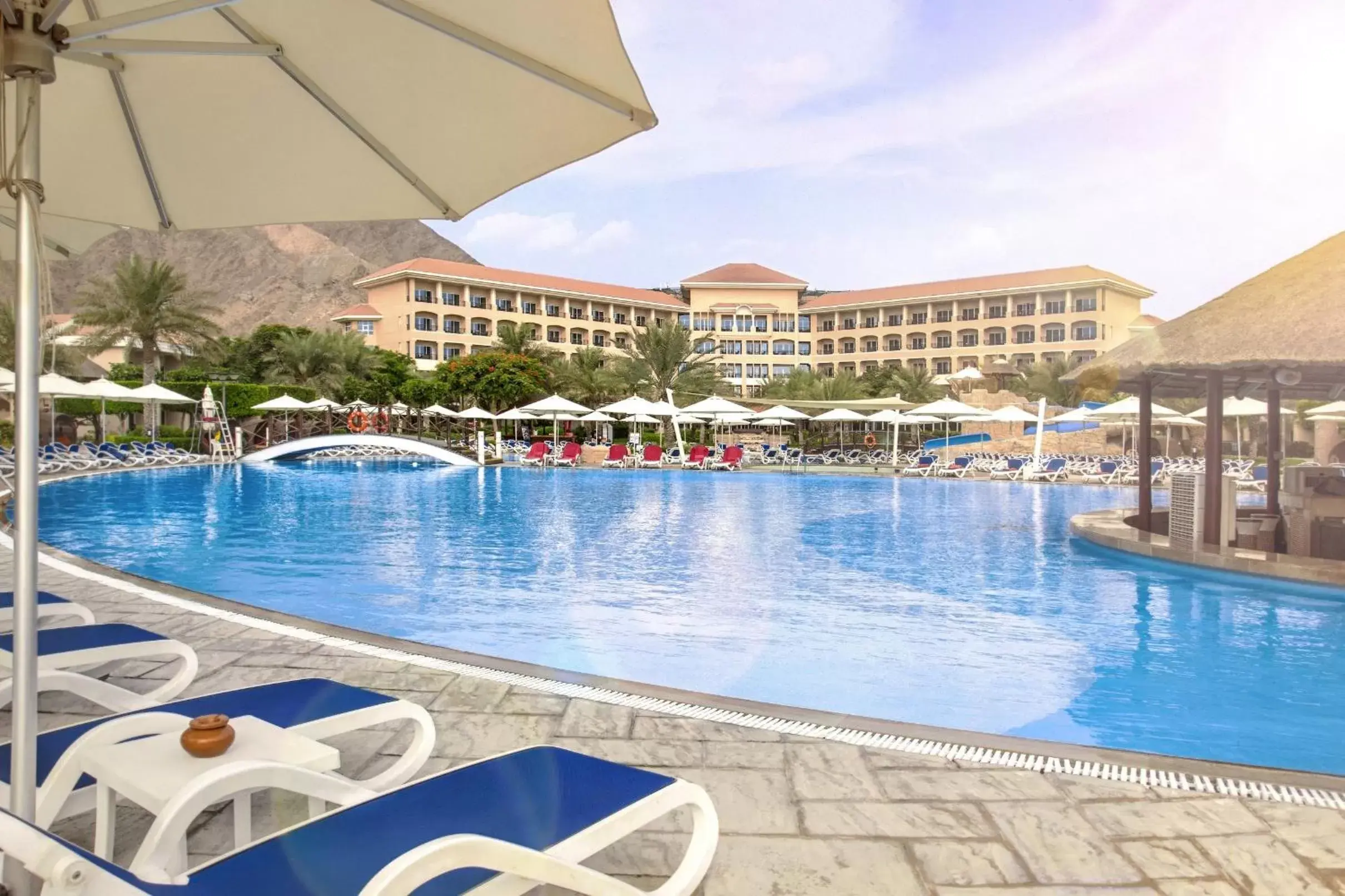 Property building, Swimming Pool in Fujairah Rotana Resort & Spa - Al Aqah Beach