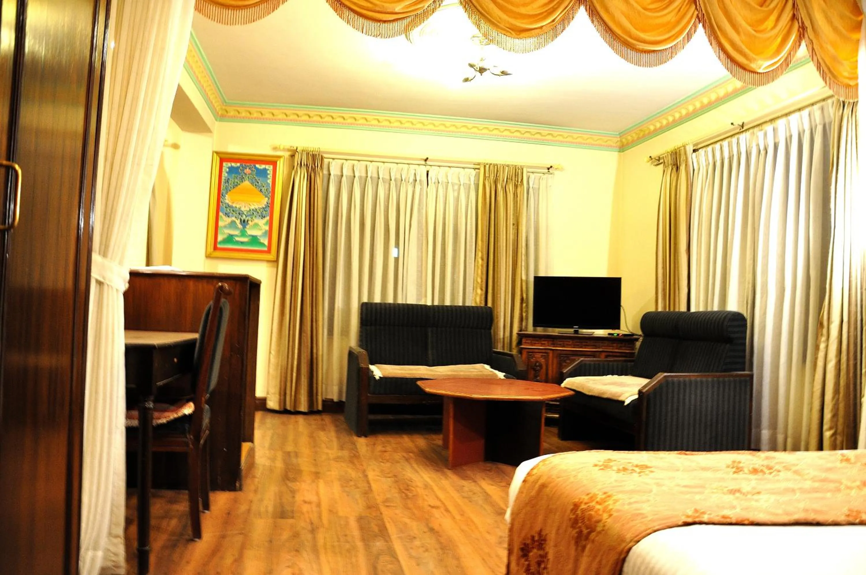 Living room, Bed in Tibet Guest House