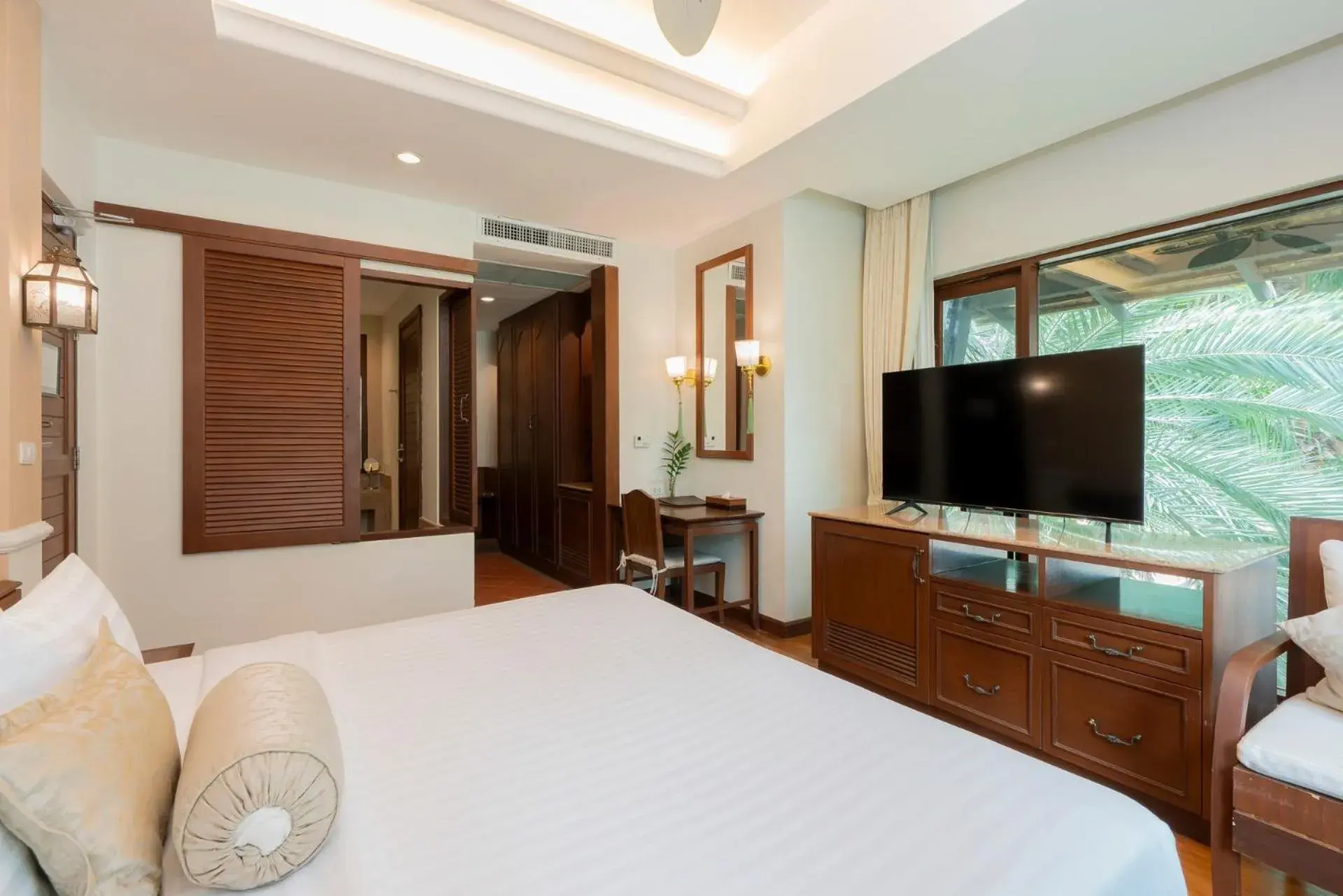 Bedroom, TV/Entertainment Center in Ravindra Beach Resort & Spa - SHA Extra Plus