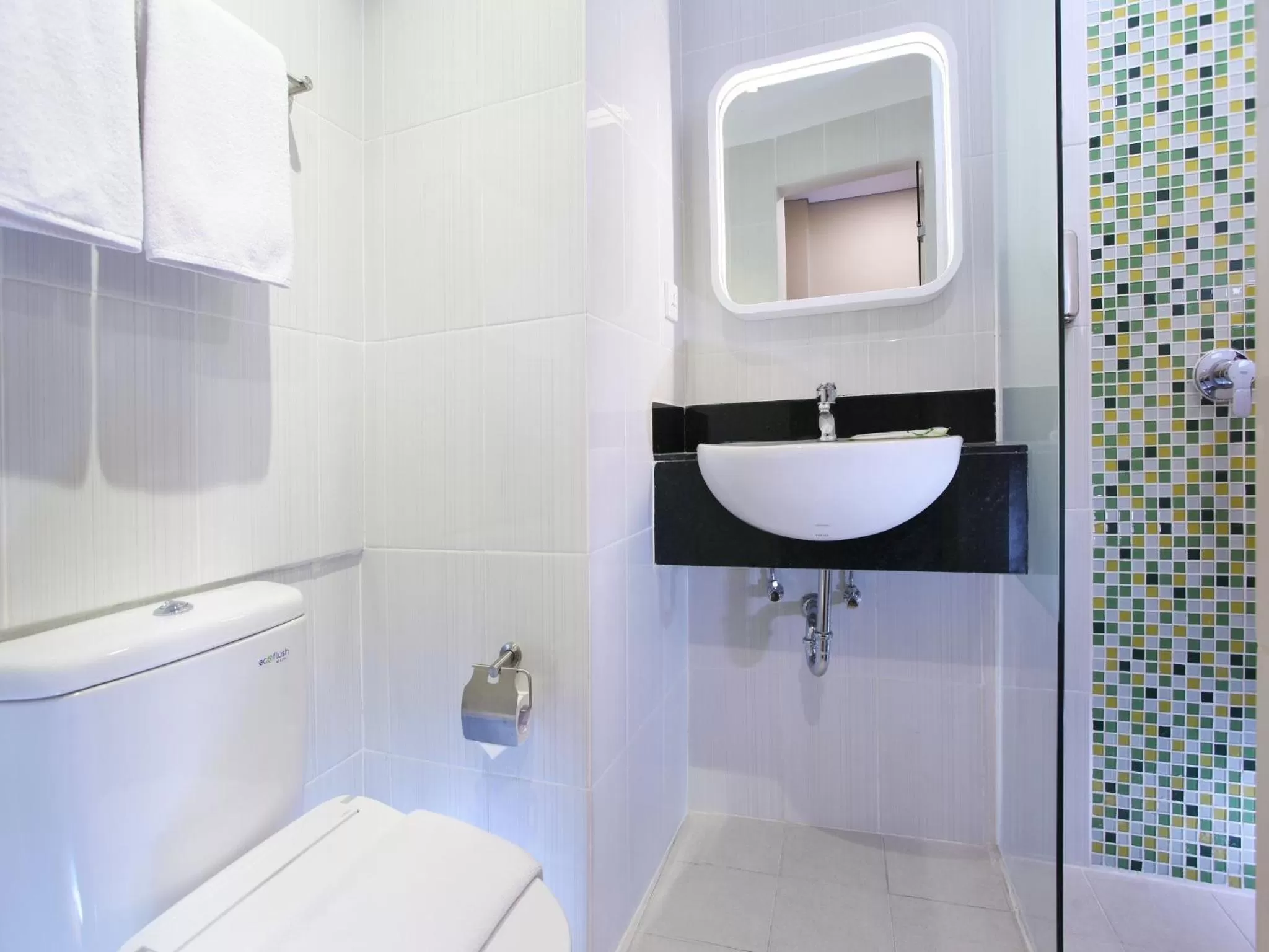 Bathroom in Zest Airport Jakarta by Swiss-Belhotel International