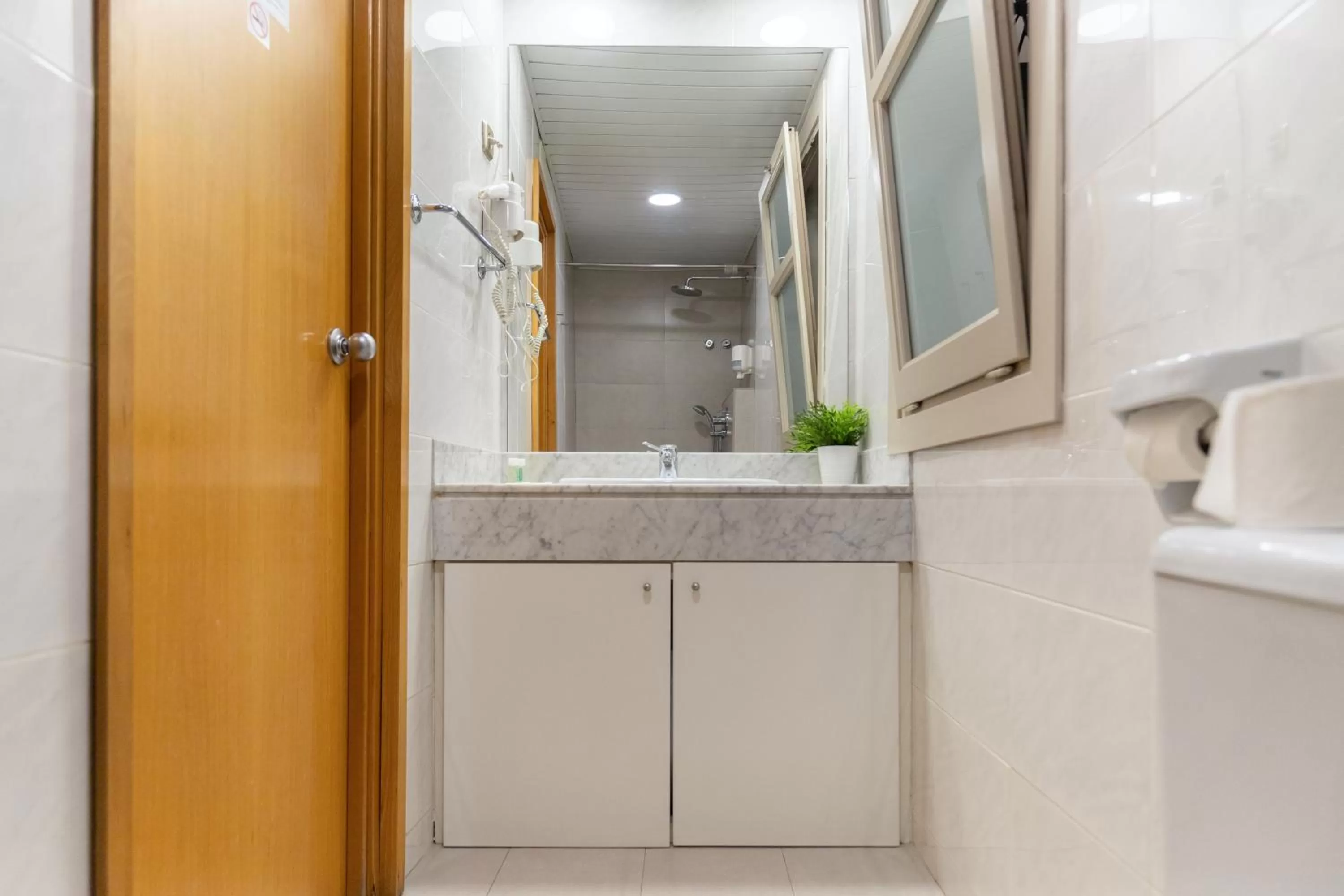 Bathroom in Atica Apartments - by Weflating