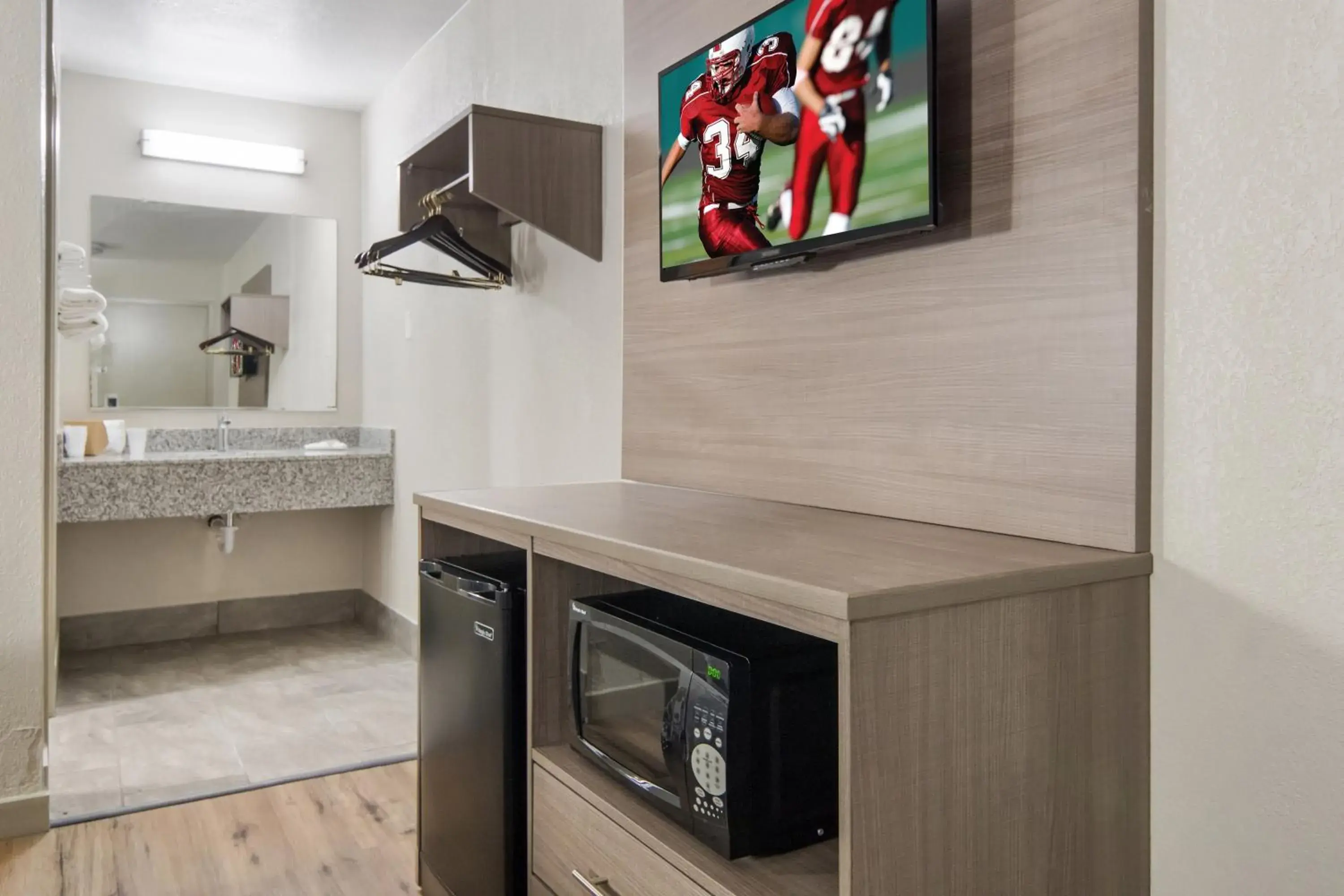 Photo of the whole room, TV/Entertainment Center in Red Roof Inn Fort Worth South