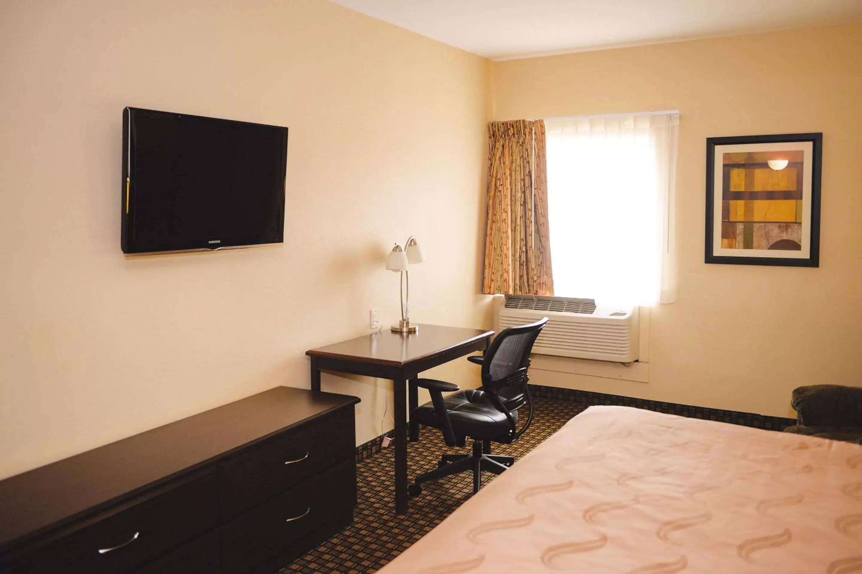 Photo of the whole room, TV/Entertainment Center in Quality Inn & Suites Ames Conference Center Near ISU Campus