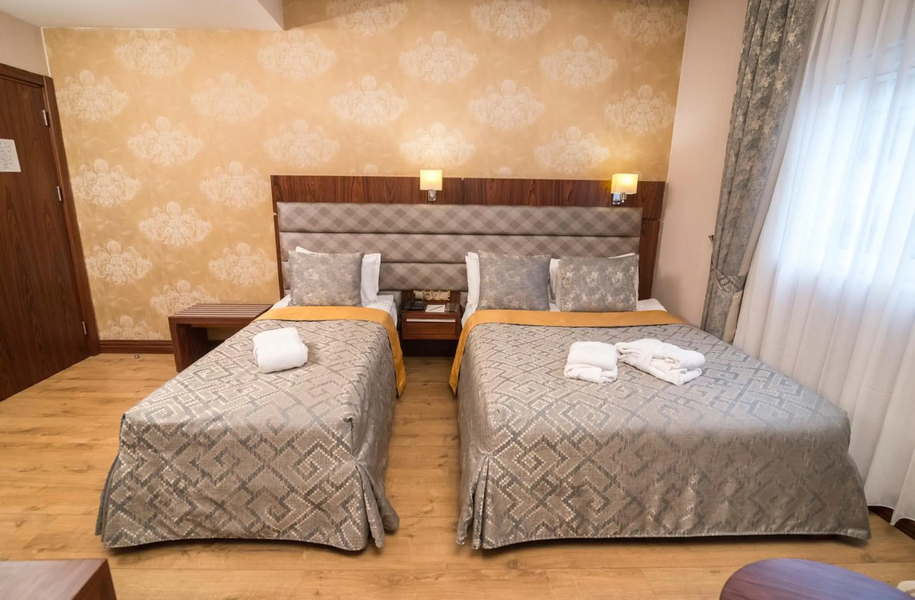 Bed in MidMar Deluxe Hotel Bed in MidMar Deluxe Hotel