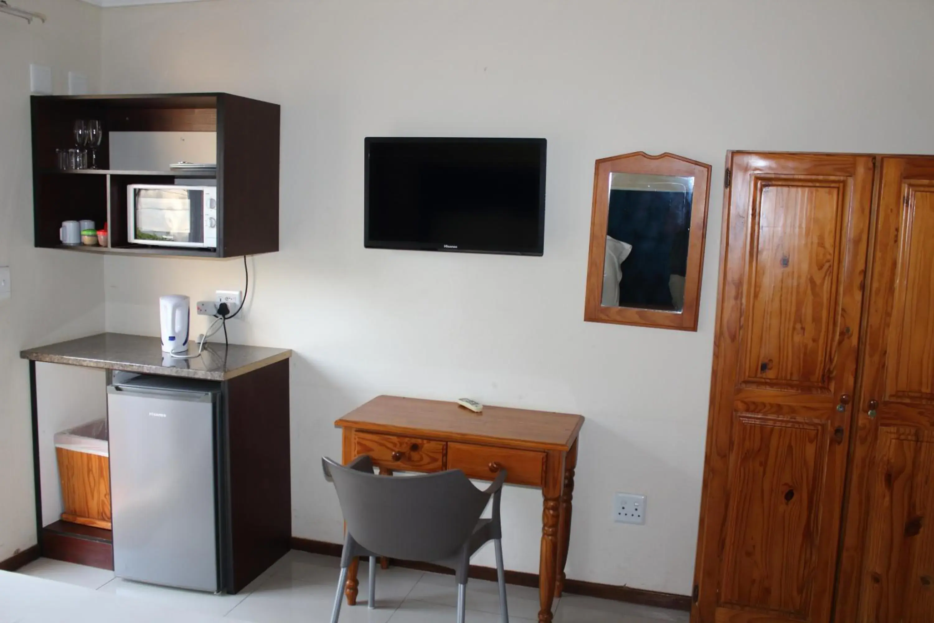 TV and multimedia, TV/Entertainment Center in Purple Olive Guest House