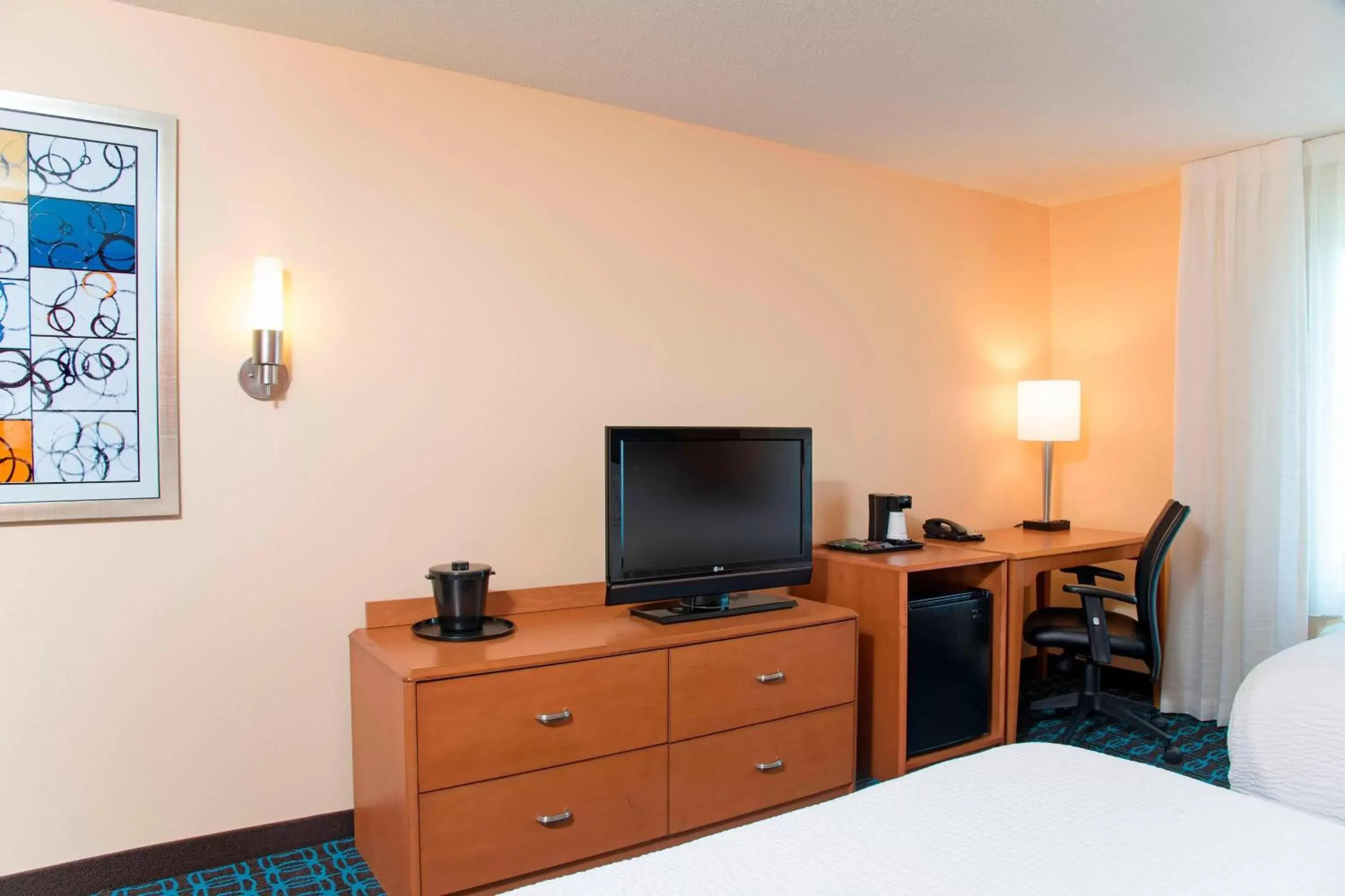 Photo of the whole room, TV/Entertainment Center in Fairfield Inn & Suites by Marriott Omaha Downtown