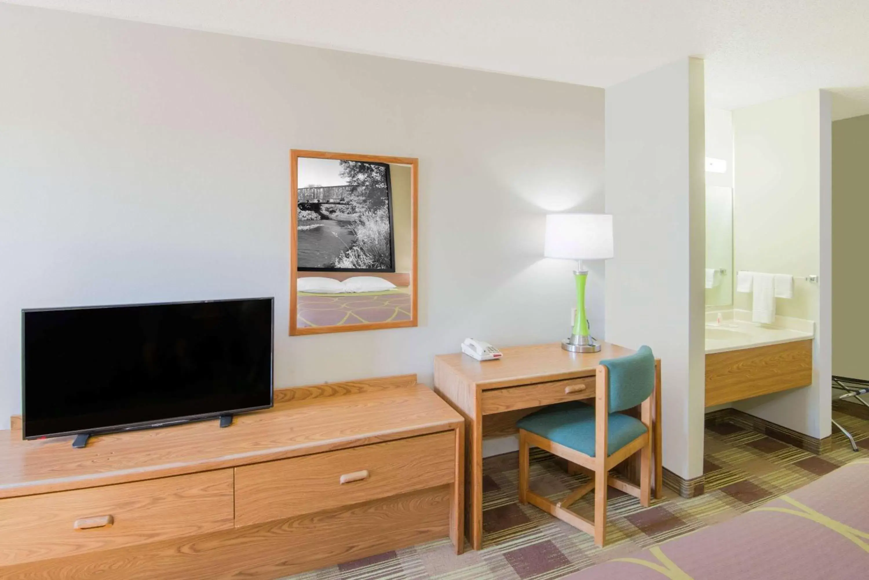 Photo of the whole room, TV/Entertainment Center in Super 8 by Wyndham Toledo