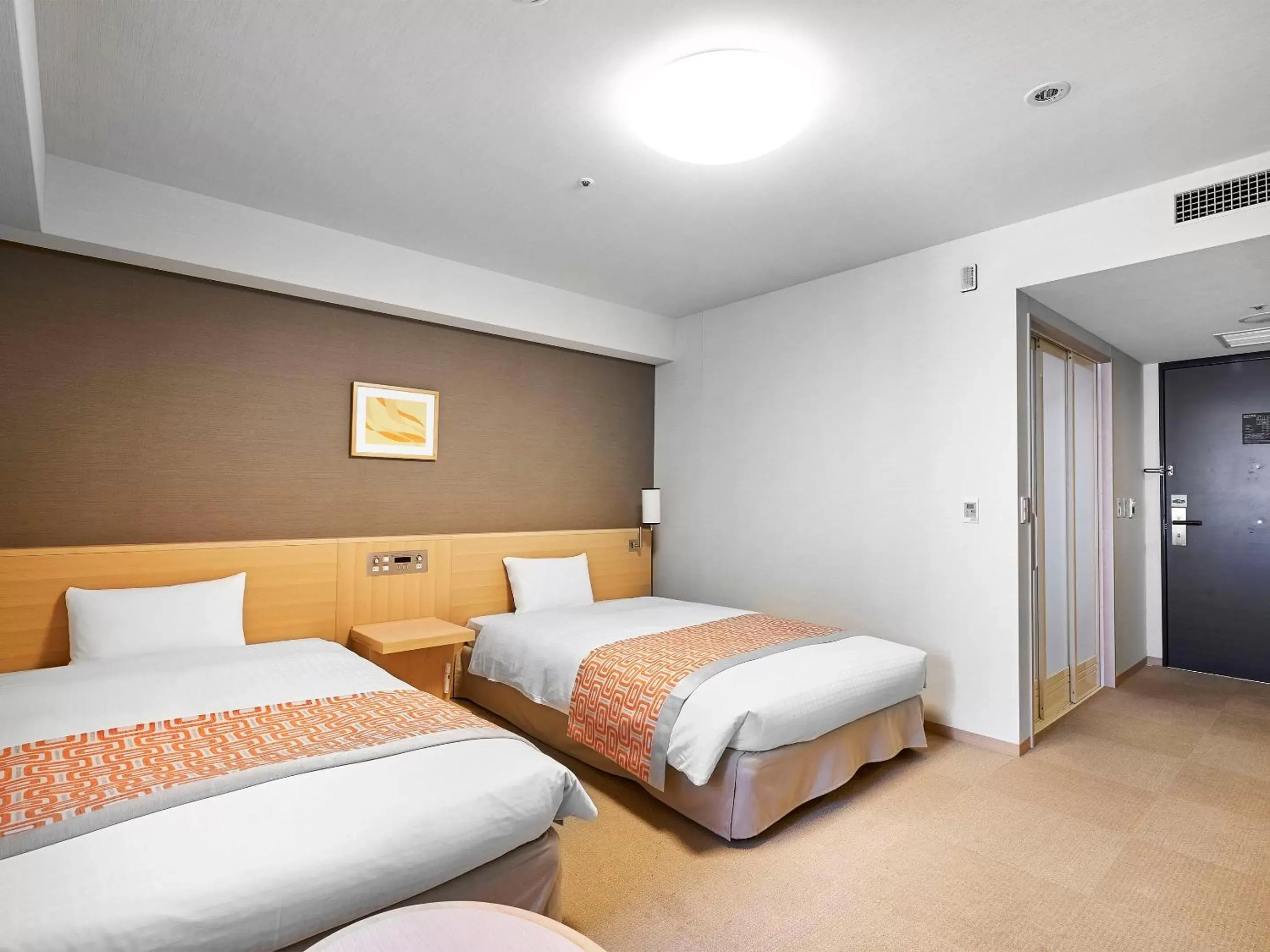 Photo of the whole room, Bed in Daiwa Roynet Hotel Hiroshima