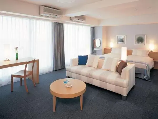 Photo of the whole room, Seating Area in The Beach Tower Okinawa Hotel