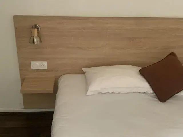 Bed in Hôtel des Etats-Unis