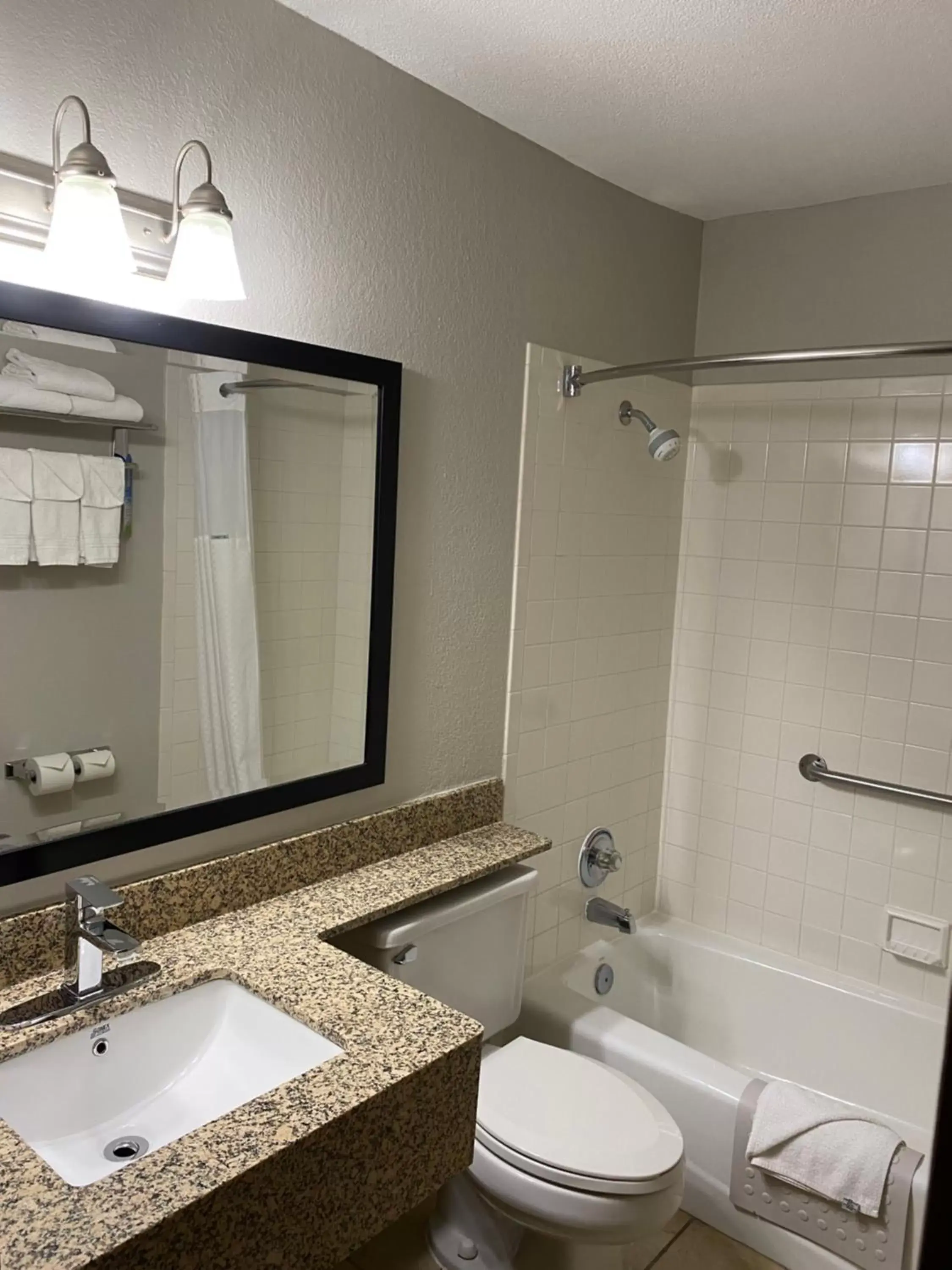 Bathroom in Days Inn & Suites by Wyndham Des Moines Airport