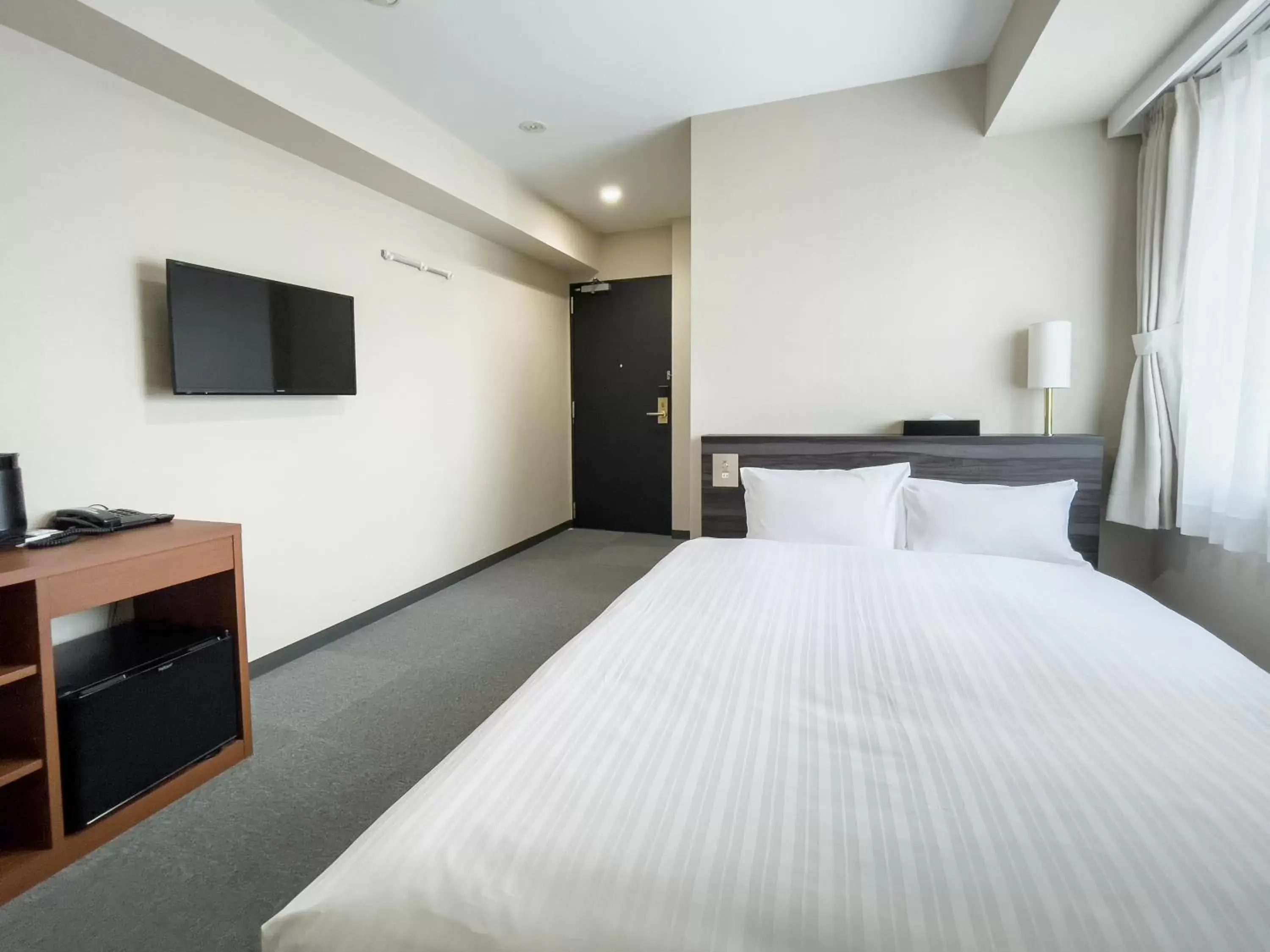 Bed in CHECKinn Osaka Shinimamiya Bed in CHECKinn Osaka Shinimamiya