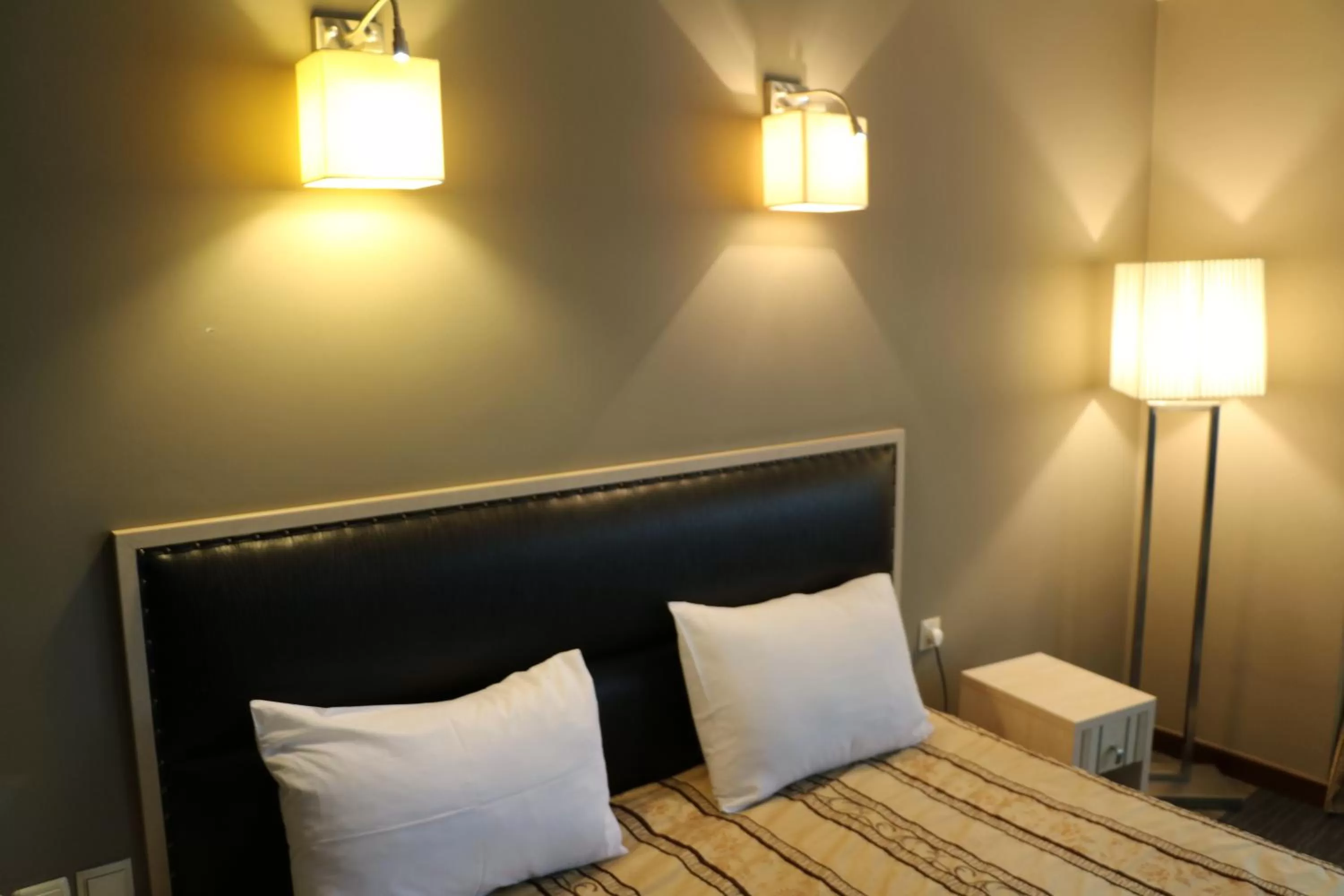 Seating area, Bed in Aktau Hotel