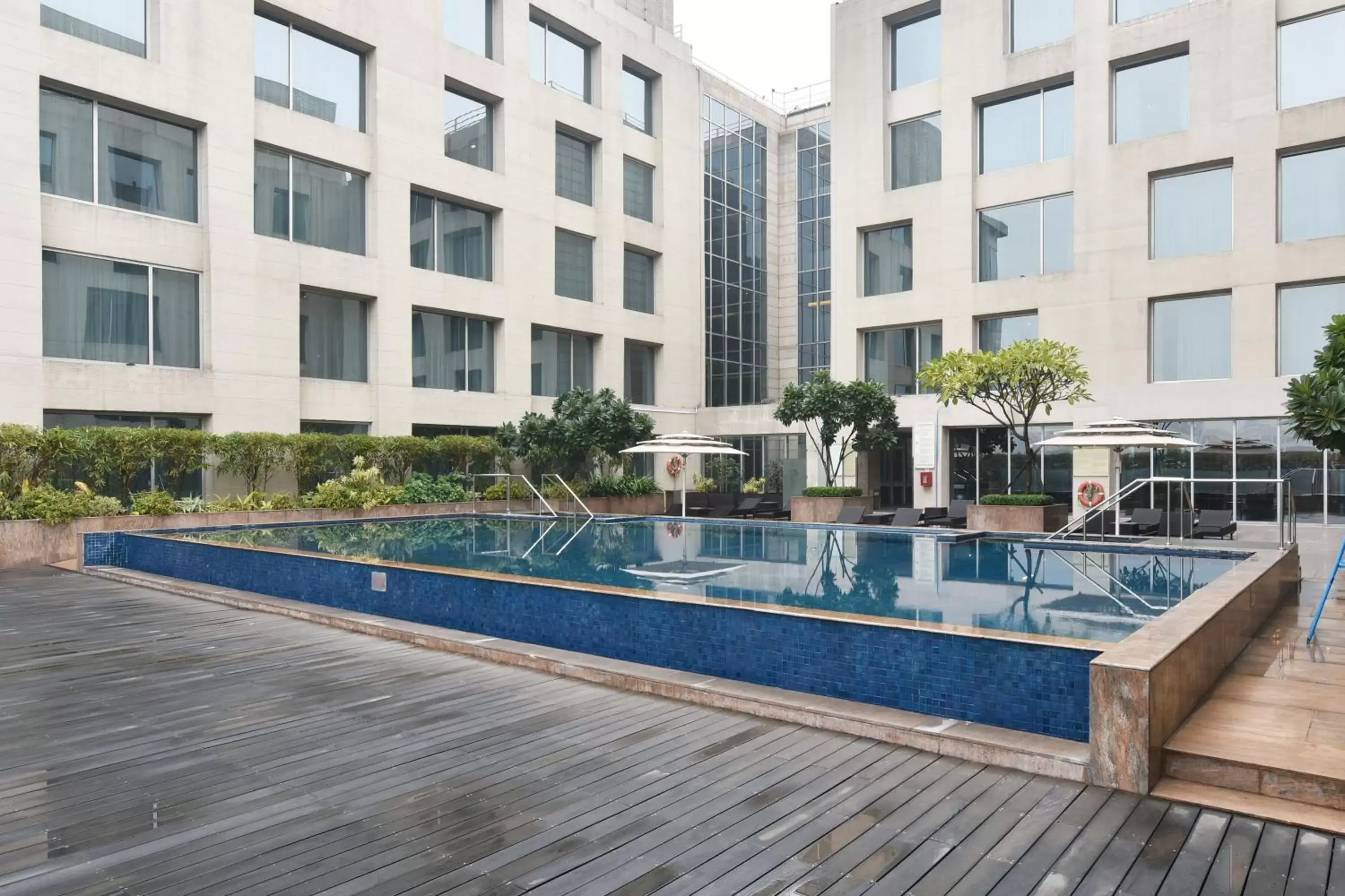 Property building, Swimming Pool in Holiday Inn New Delhi International Airport, an IHG Hotel