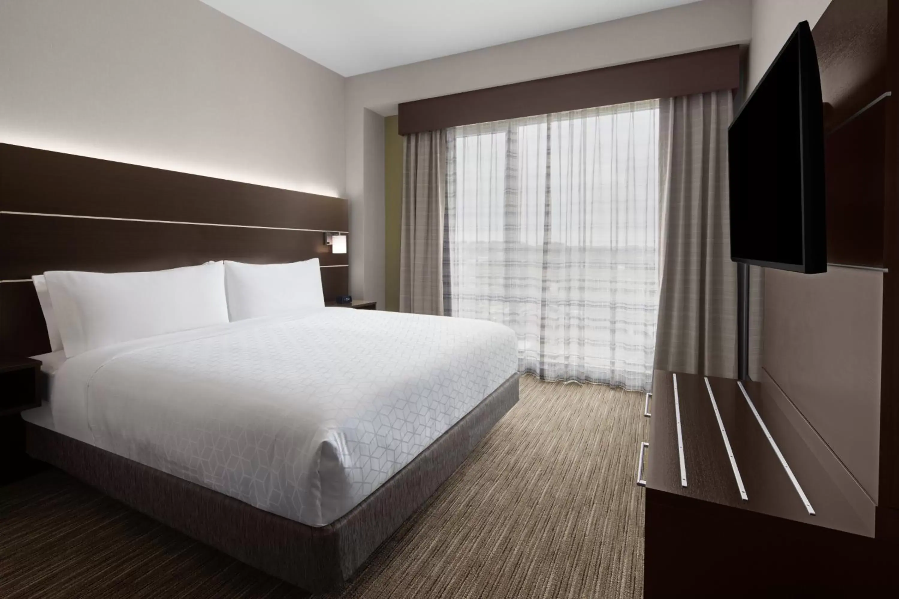 Bedroom, Bed in Holiday Inn Express & Suites - Woodside Queens NYC, an IHG Hotel