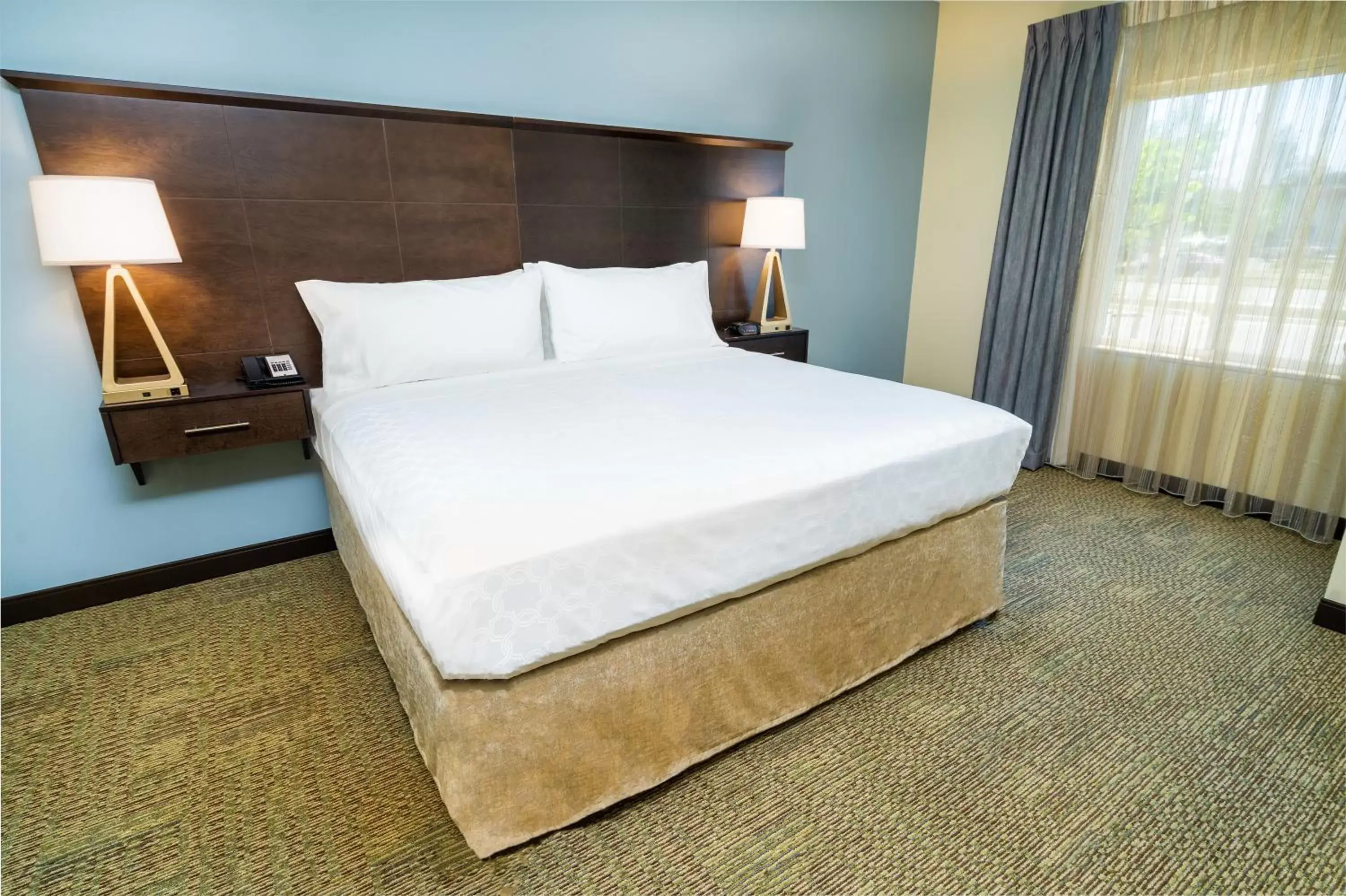 Bed in Staybridge Suites Corona South, an IHG Hotel