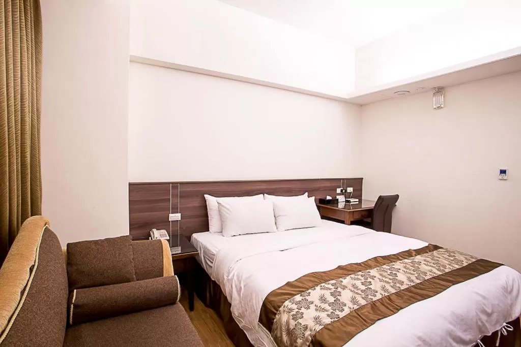Bed in Huang Shin Business Hotel-Chung Kang