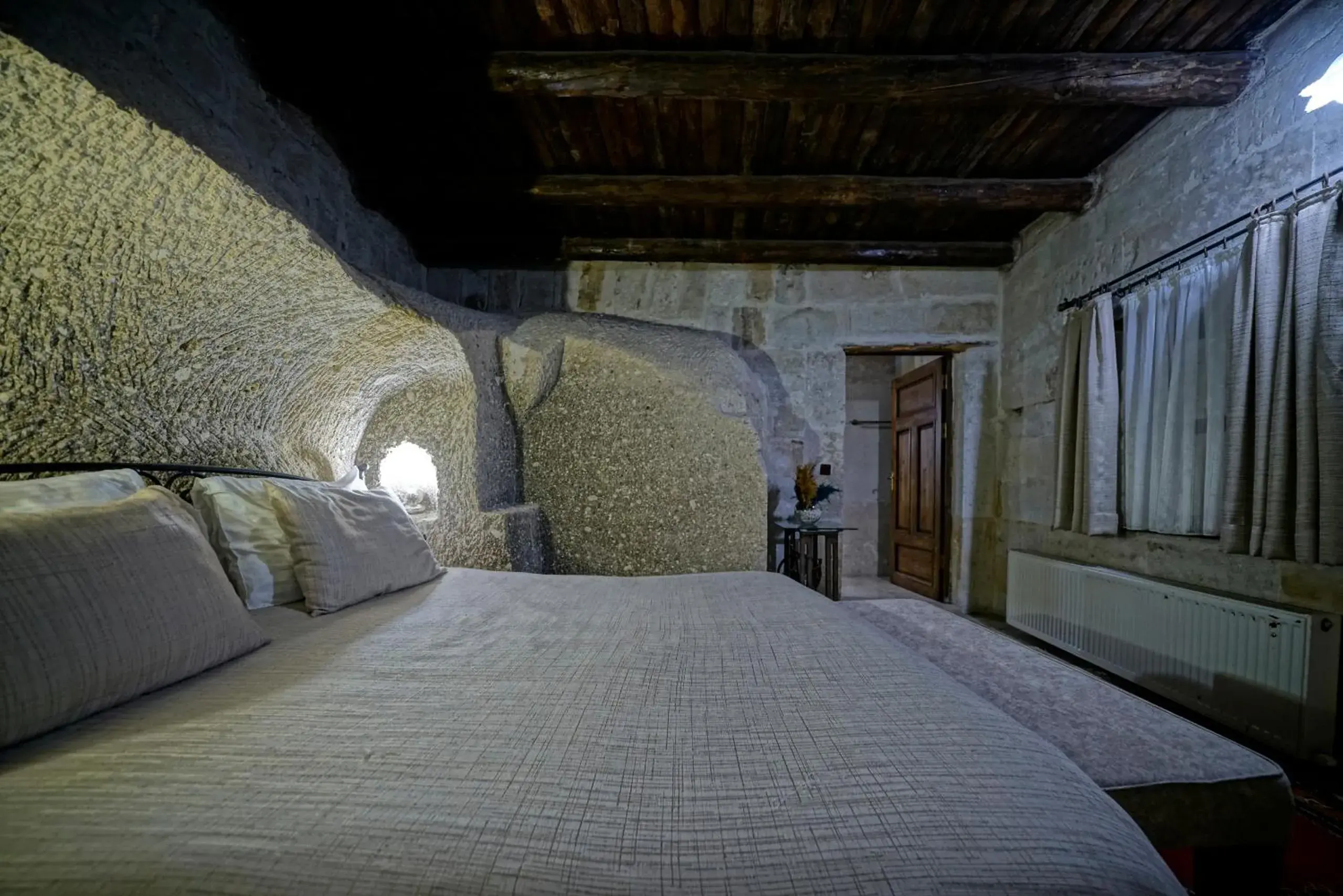 Bed in Holiday Cave Hotel