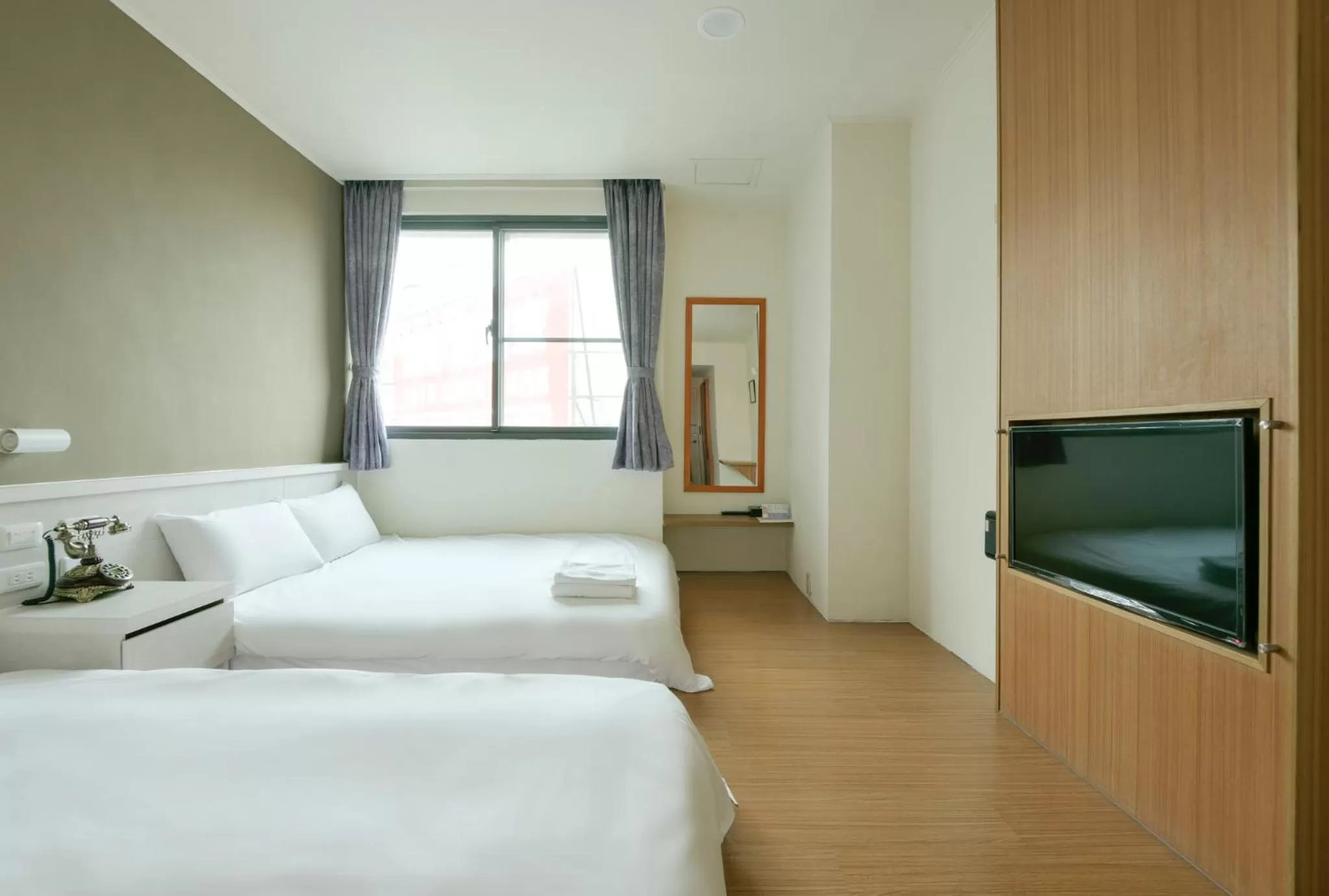 Bed in Raise Hotel Taichung