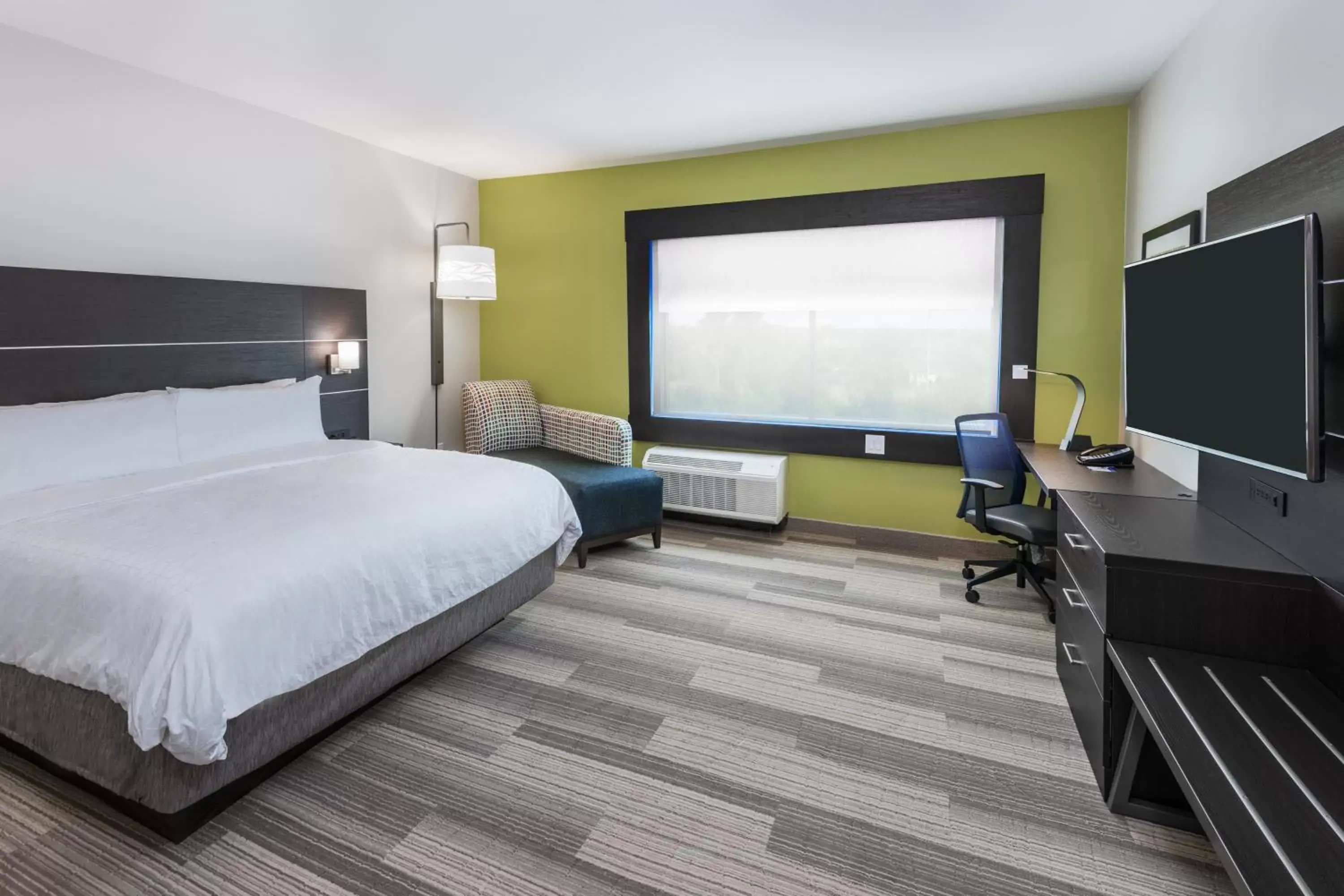 Photo of the whole room, TV/Entertainment Center in Holiday Inn Express & Suites Bryan - College Station, an IHG Hotel