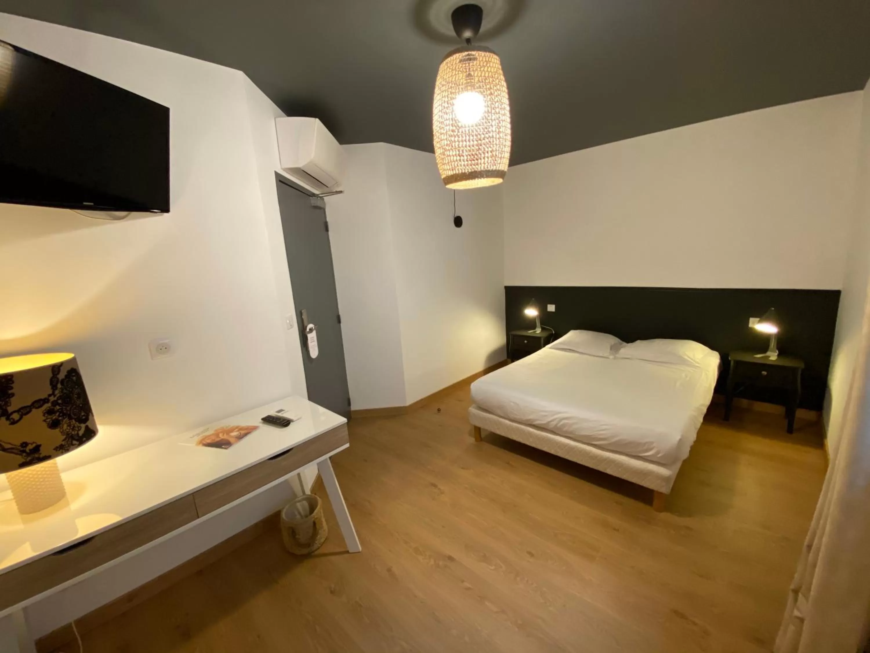 Bedroom in Le Miredames Hôtel-Bar