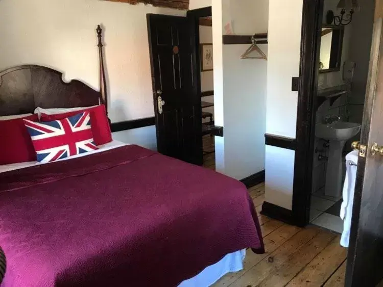 Bed in The Olde Angel Inn