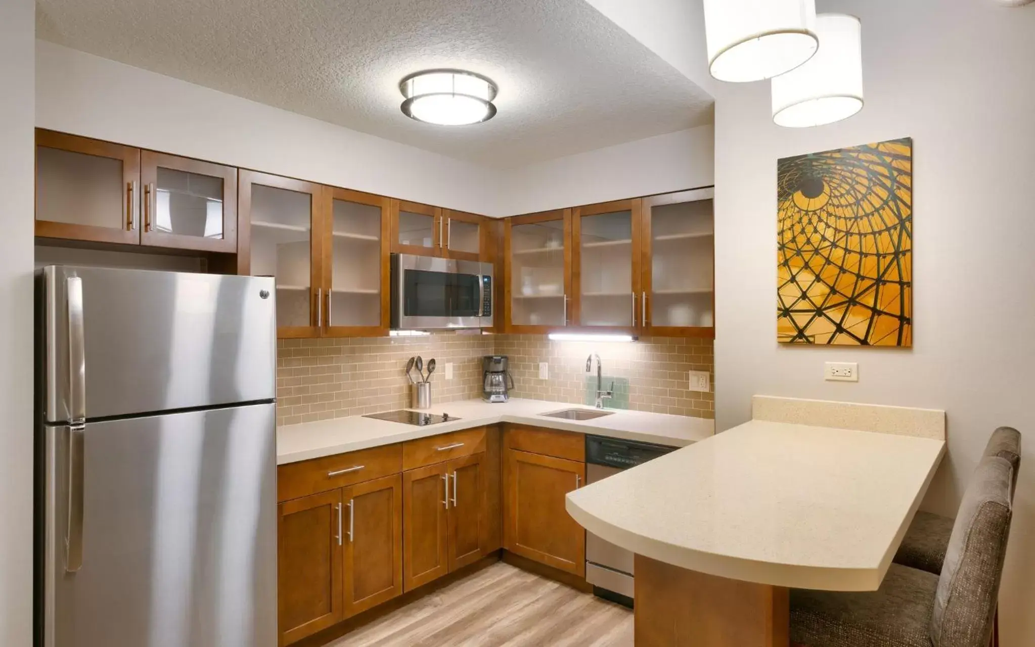 Photo of the whole room, Kitchen/Kitchenette in Staybridge Suites - Gainesville I-75, an IHG Hotel