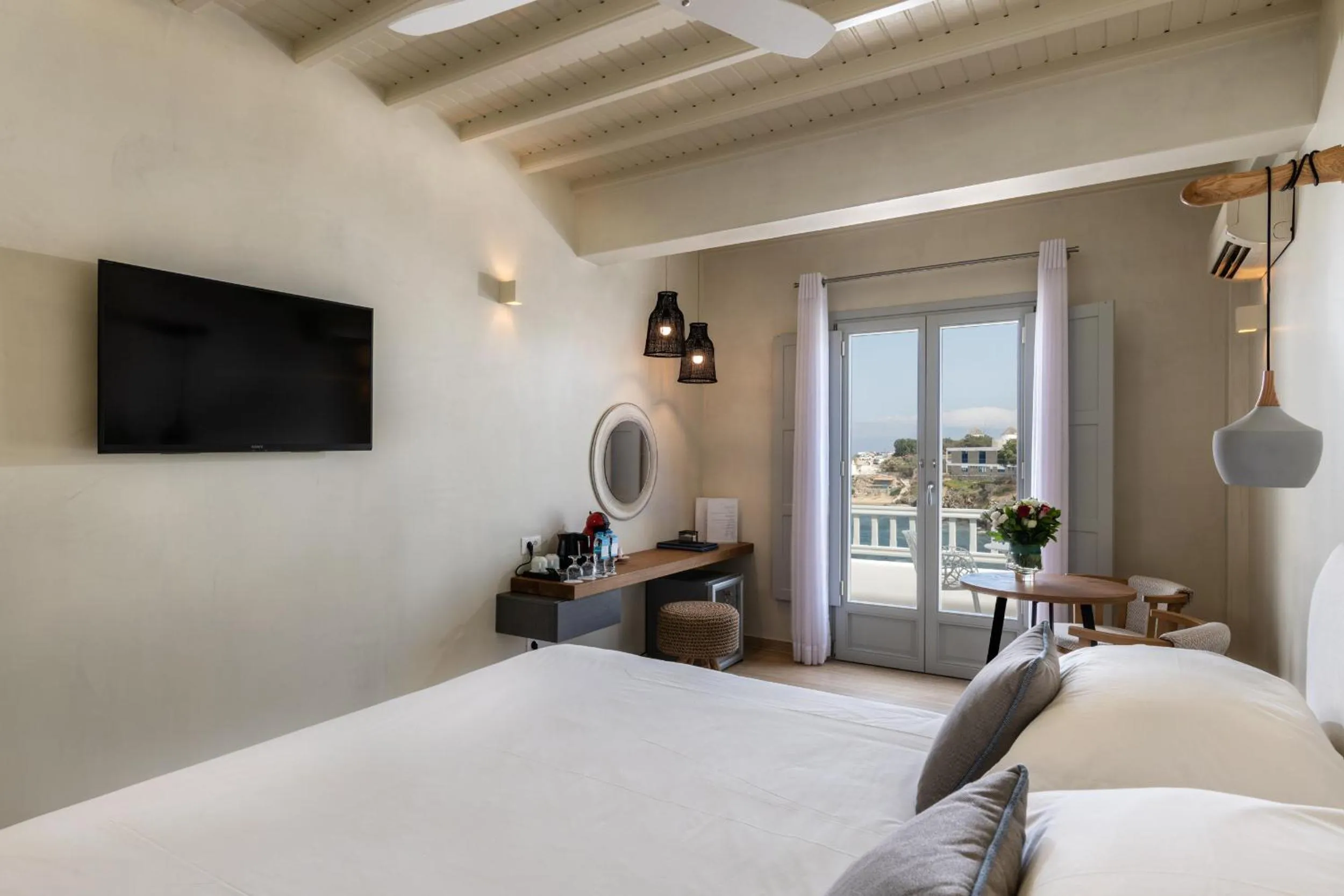 Bed in Poseidon Hotel Suites