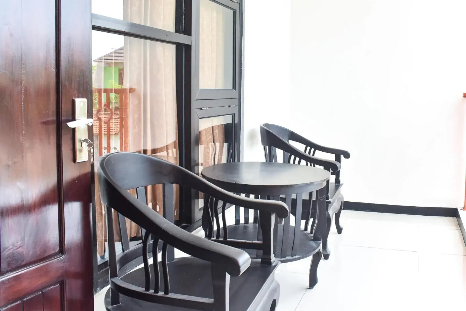 Balcony/Terrace, Dining Area in RedDoorz Syariah near Gelora Delta Sidoarjo 2