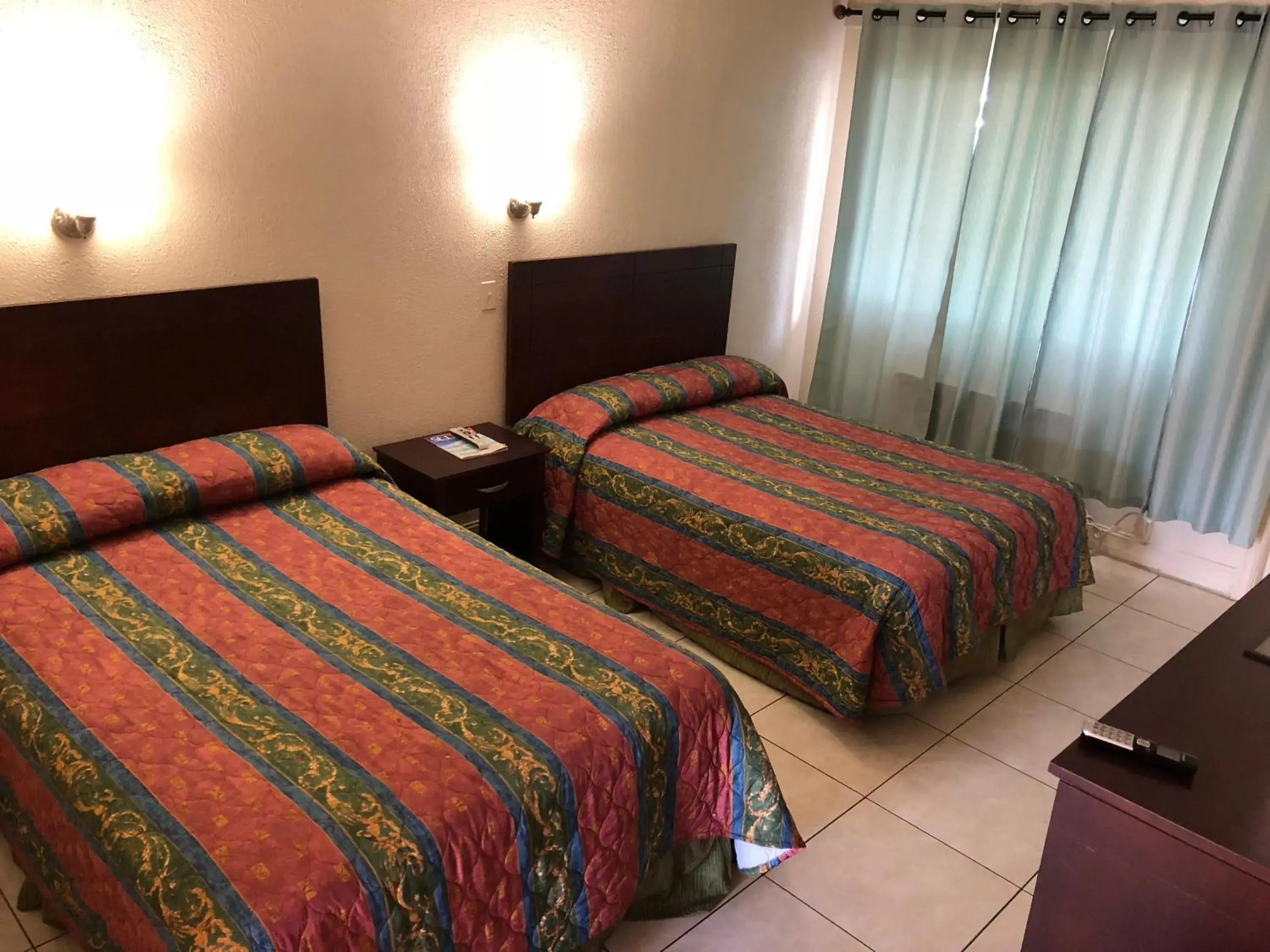 Bed in Sunset Inn- Fort Pierce, FL