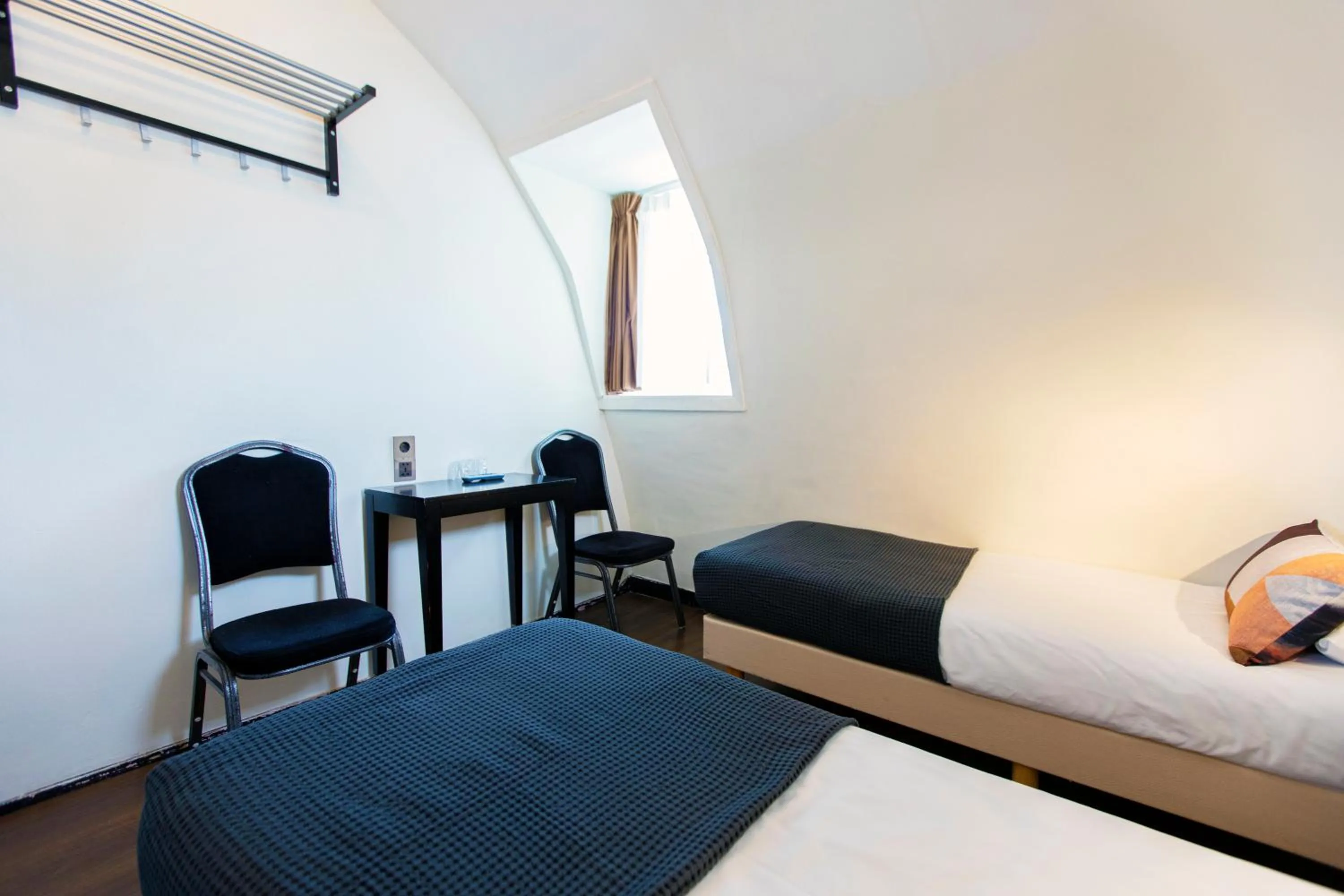 Bed in Quentin Arrive Hotel