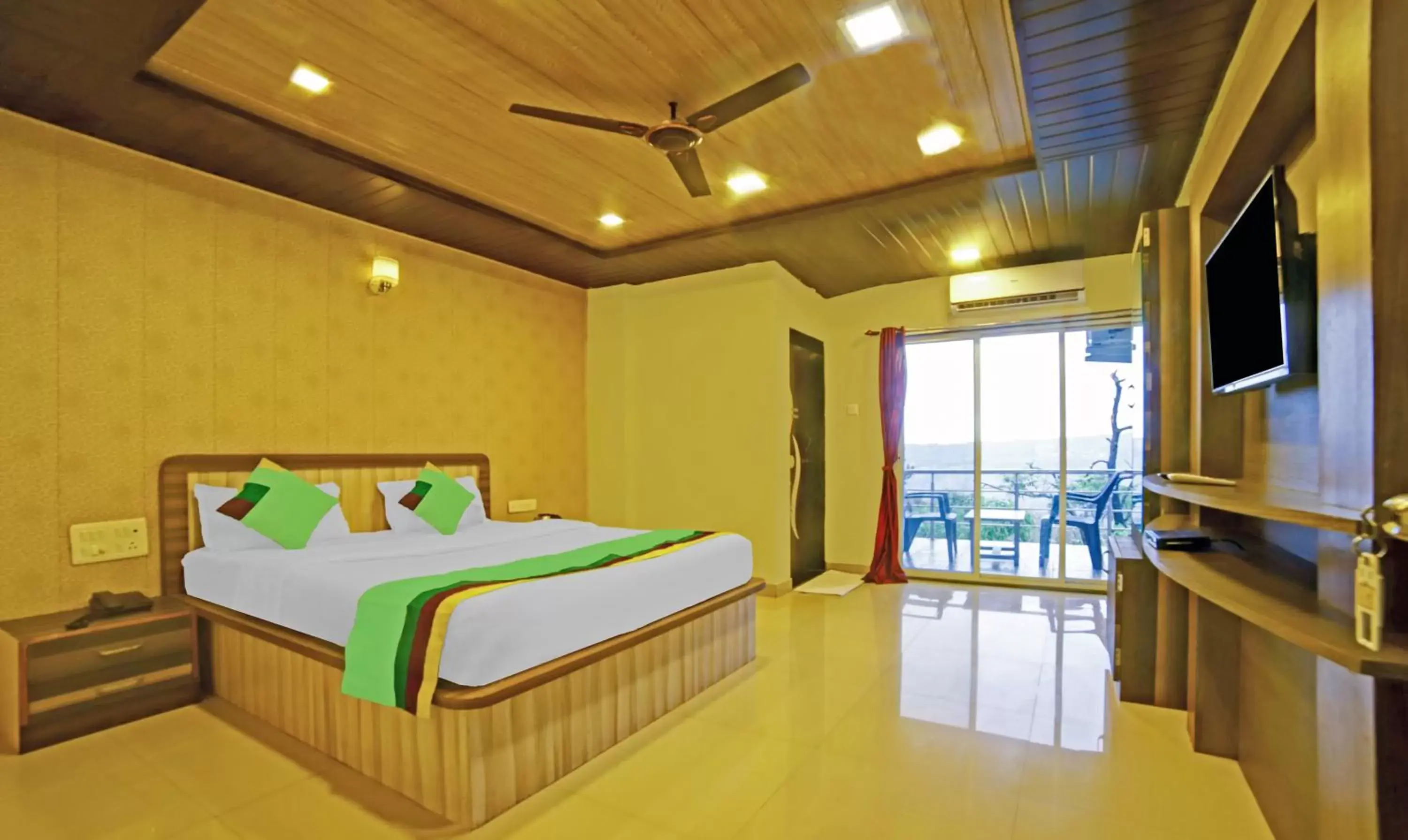 Bedroom, Bed in Treebo Balaji Excellency with Pool & Spa Bedroom, Bed in Treebo Balaji Excellency with Pool & Spa