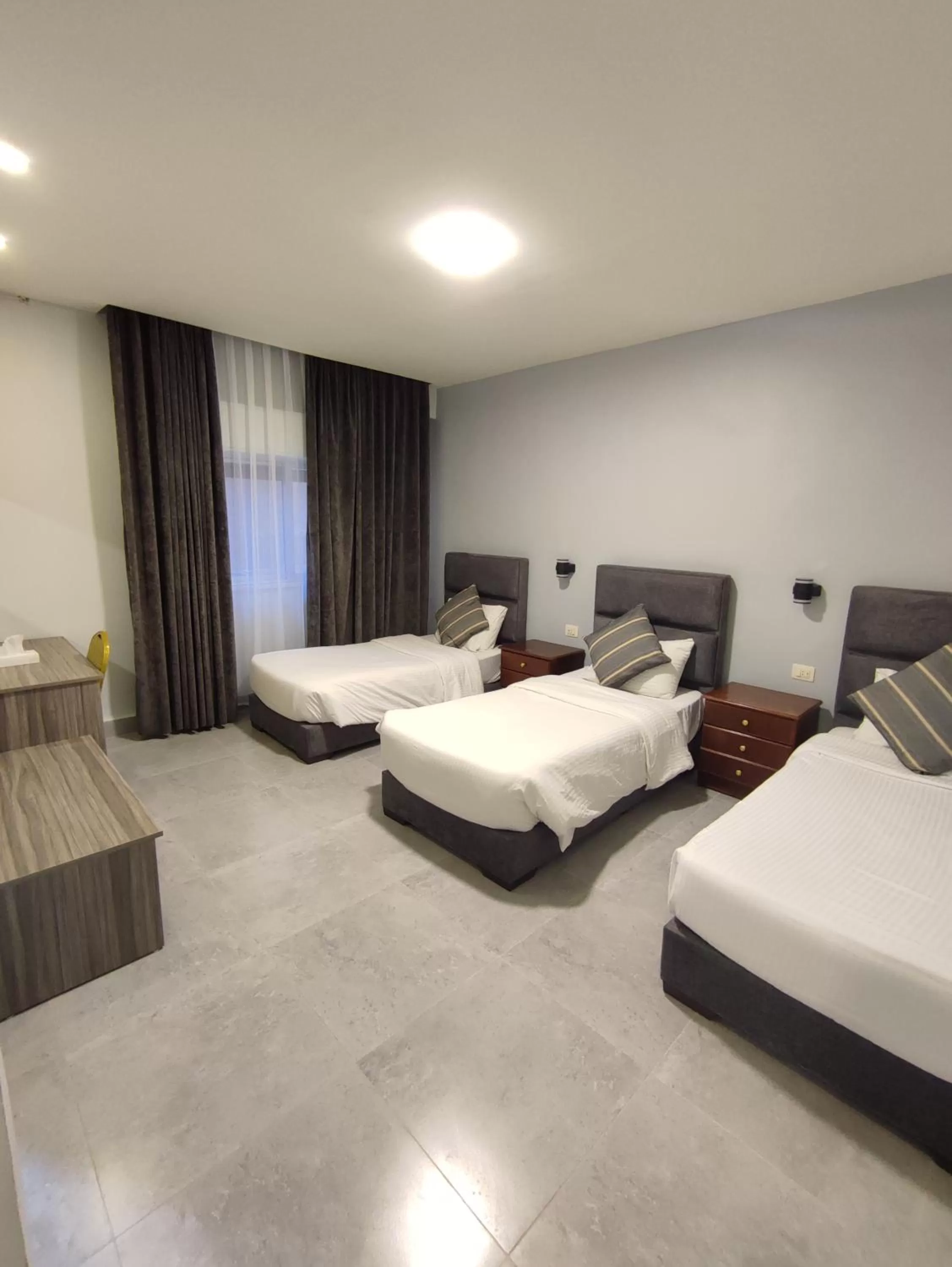 Bed in Black Iris Hotel