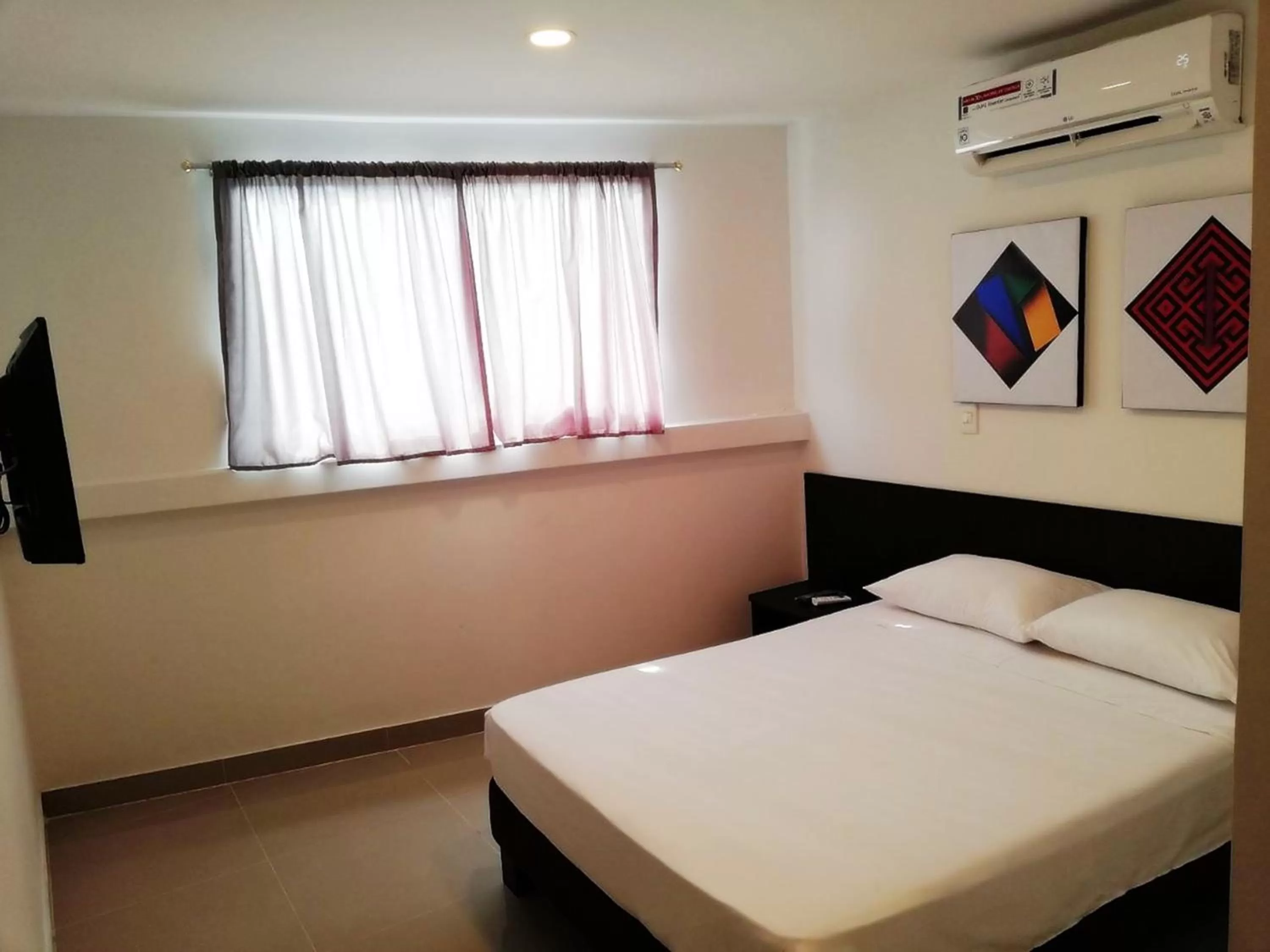 Bed in Apartasuites San Marcos